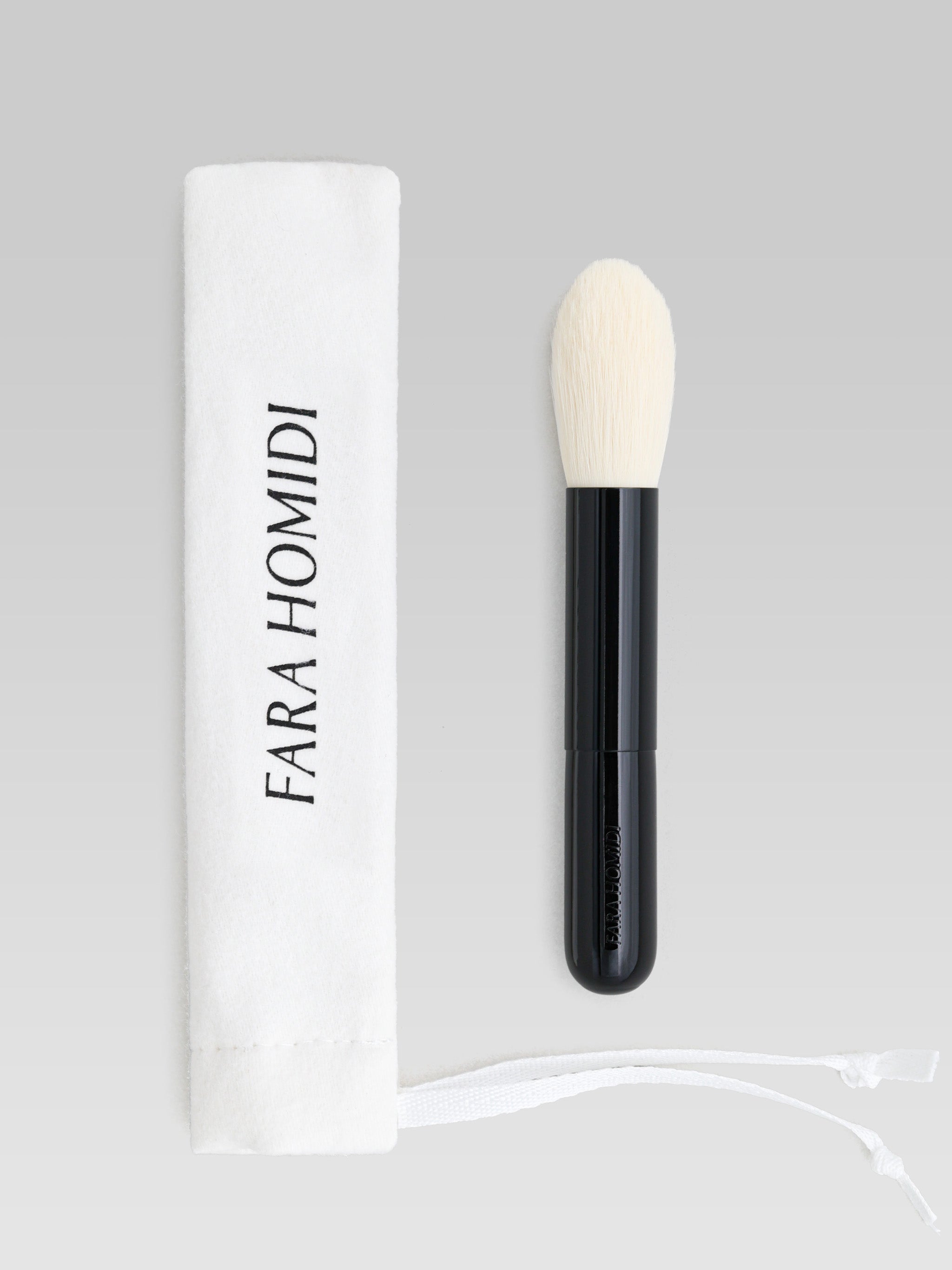 FARA HOMIDI Shader Brush product shot including white bag