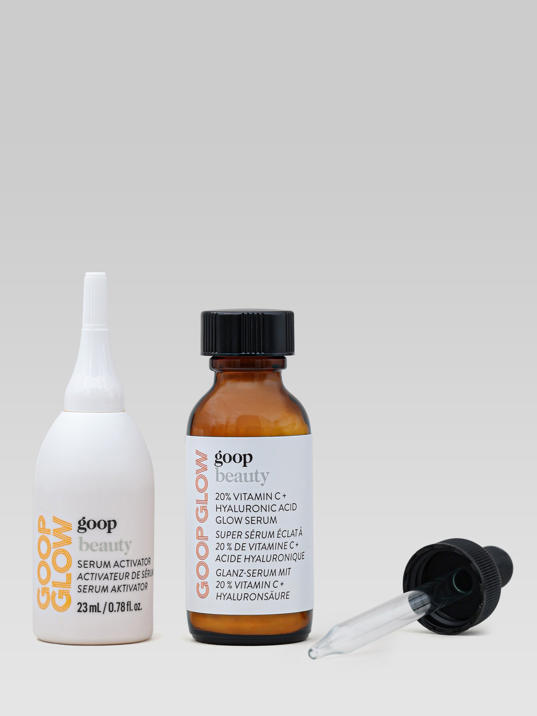 GOOP BEAUTY 20% Vitamin C + Hyaluronic Acid Glow Serum product shot both bottles