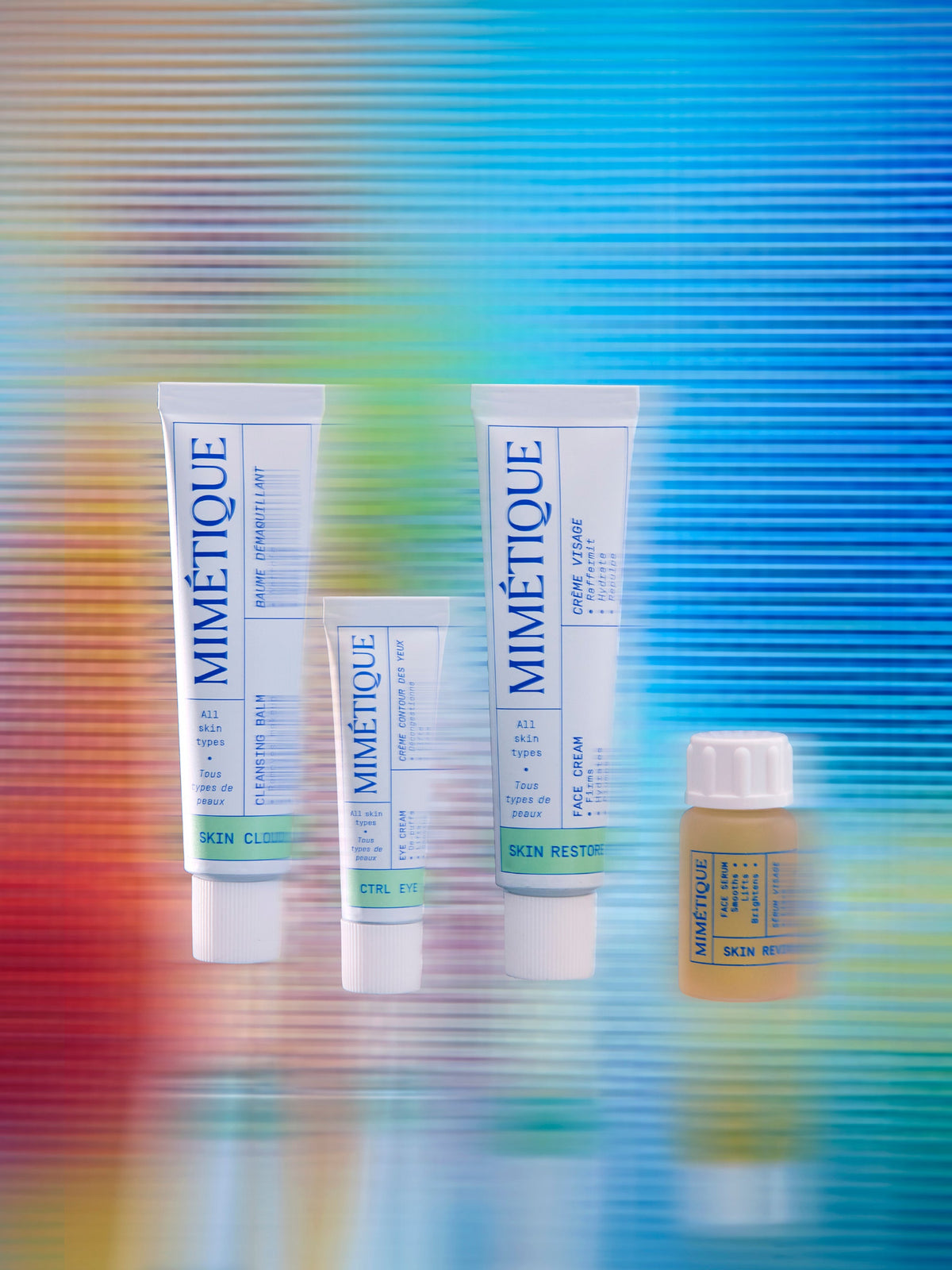 MIMÉTIQUE Skin 360° The Starter Kit all products in front of colorful, blurred background