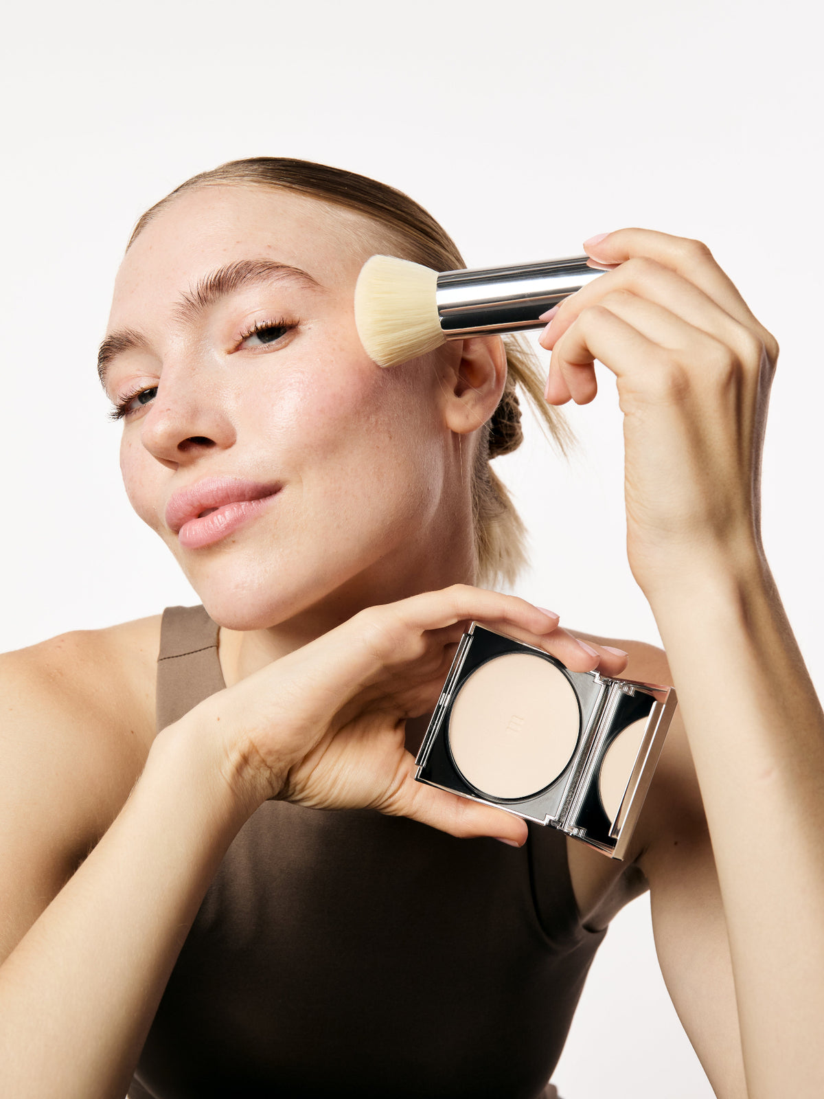 Aime Face Brush used to apply makeup to the face