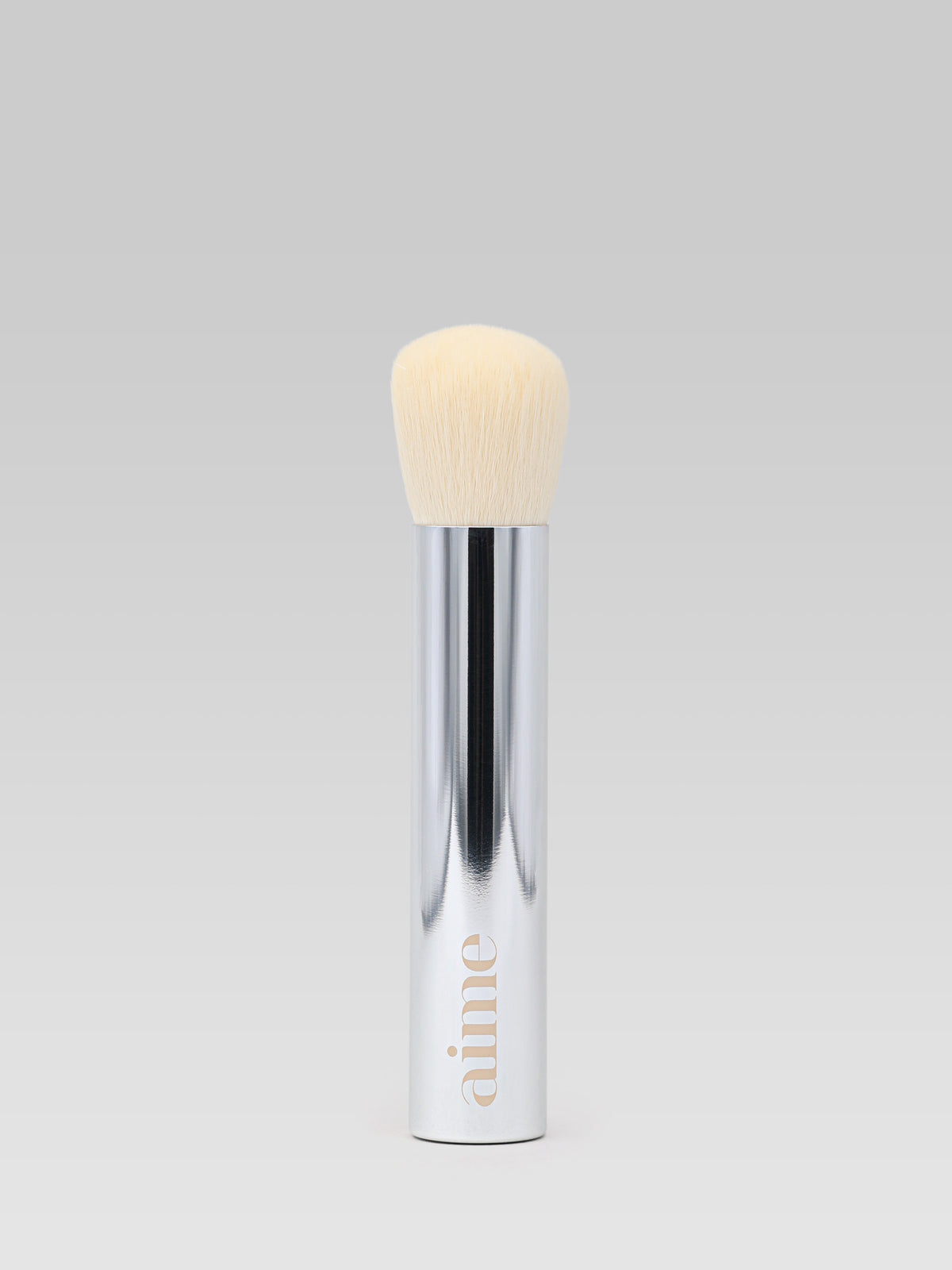 Aime Face Brush makeup brush with soft bristles and silver handle