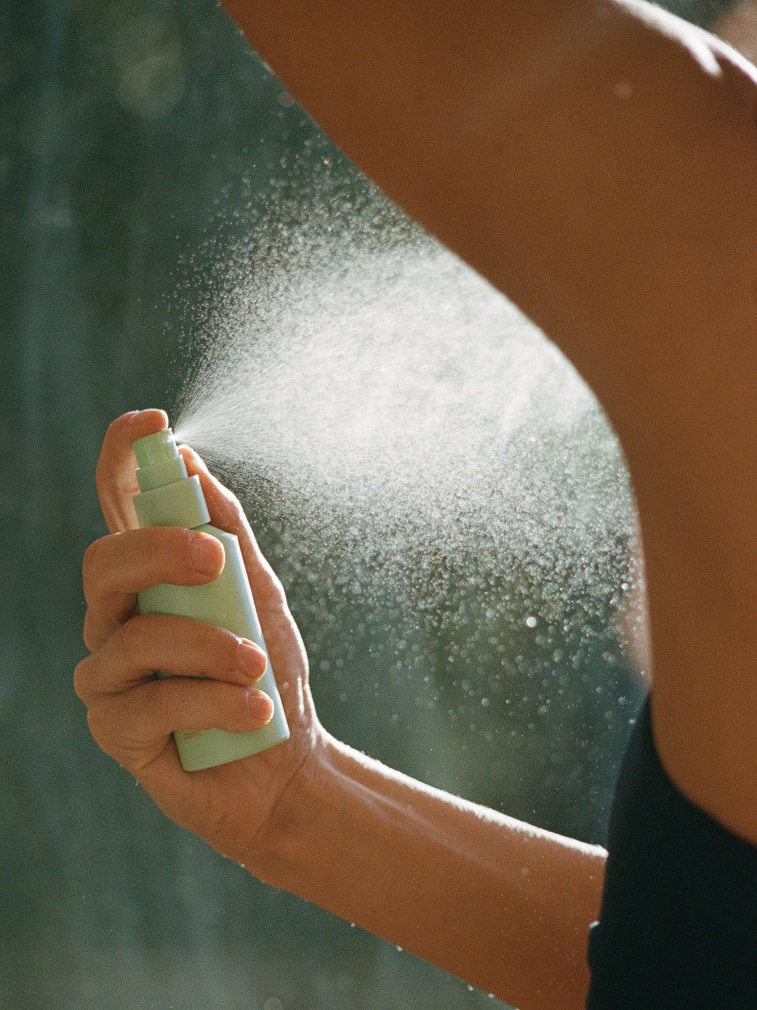 Corpus Deodorant Spray applied to underarm