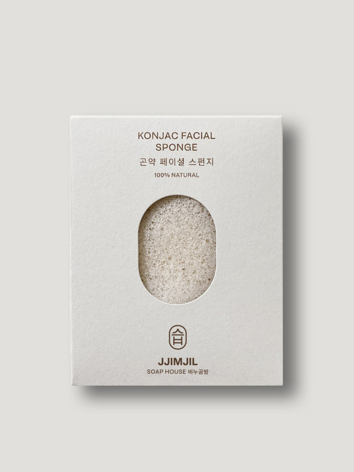 Jjimjil Pure Konjac Facial Sponge in white packaging, featuring a natural off-white sponge made from konjac