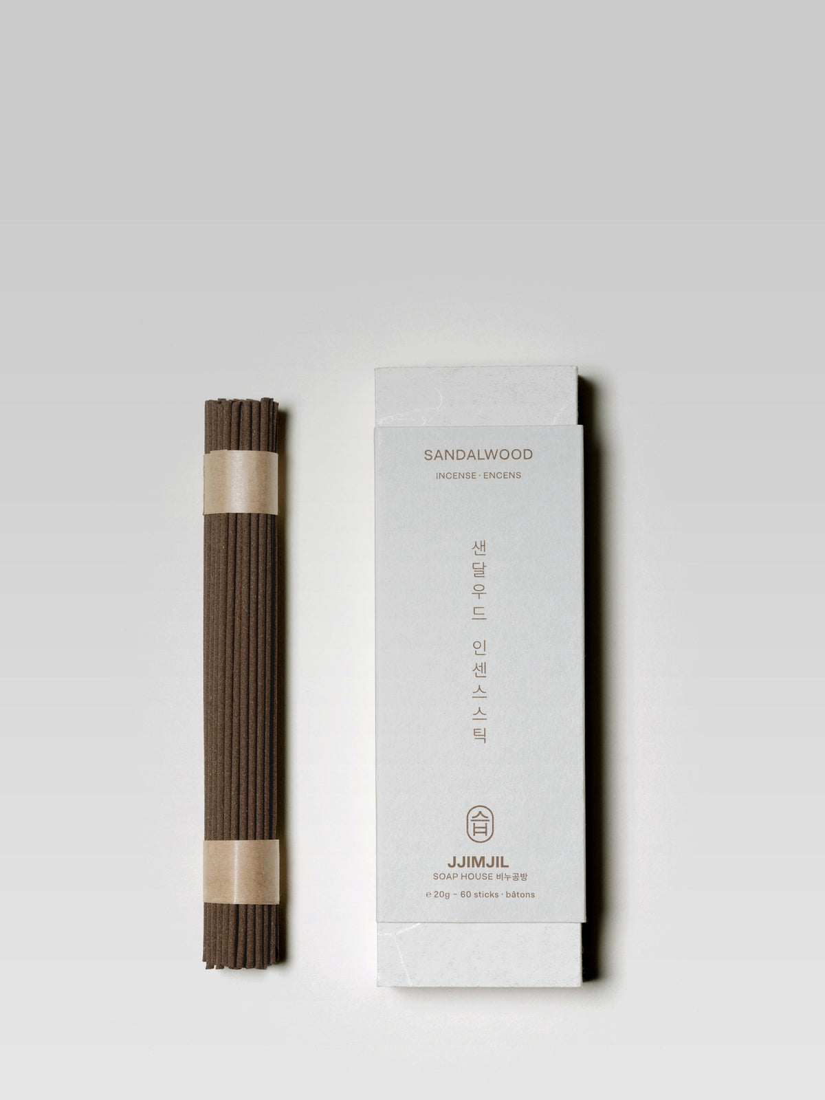 JJIMJIL Sandalwood Incense sticks beside the white product box with traditional Korean-inspired packaging