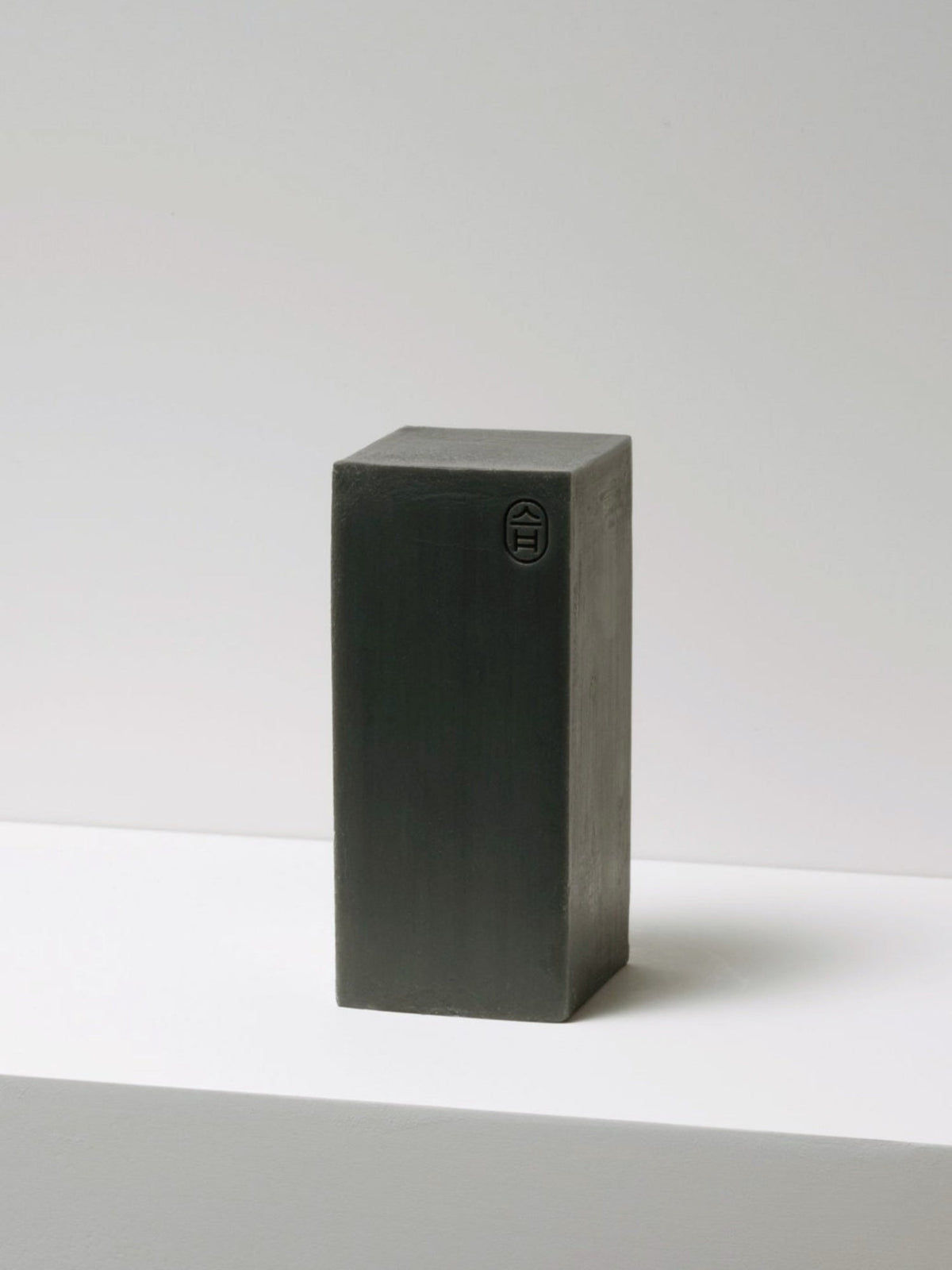 JJIMJIL Shaman Charcoal Soap in black packaging, shown from a side angle