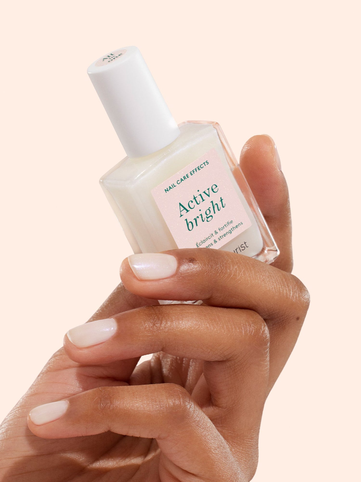 Manucurist Active Bright nail care polish held in hand