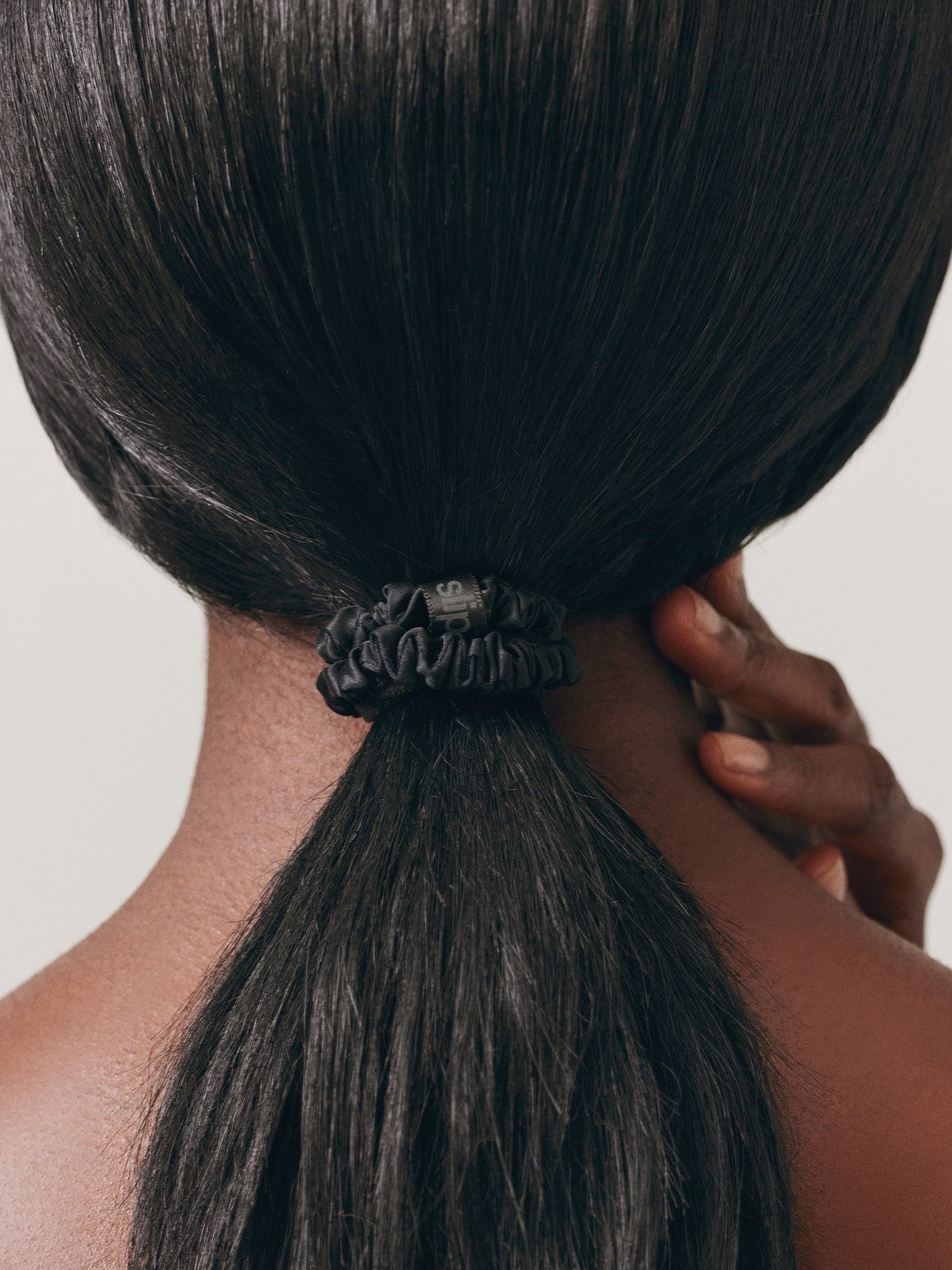 SLIP Back To Basics Skinny Scrunchie in Black worn in hair