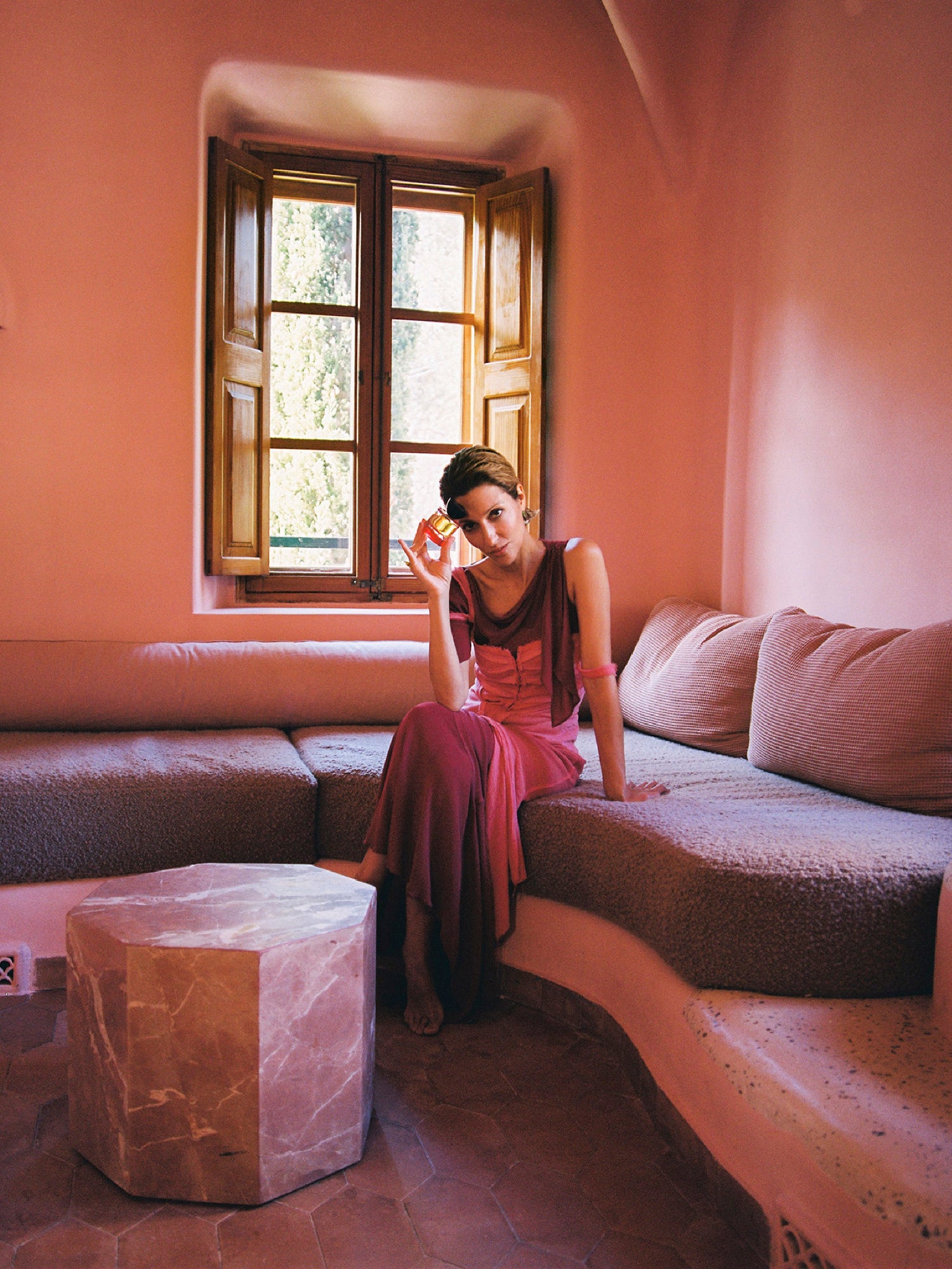 VYRAO Georgette Eau de Parfum lifestyle image with woman in pink dress