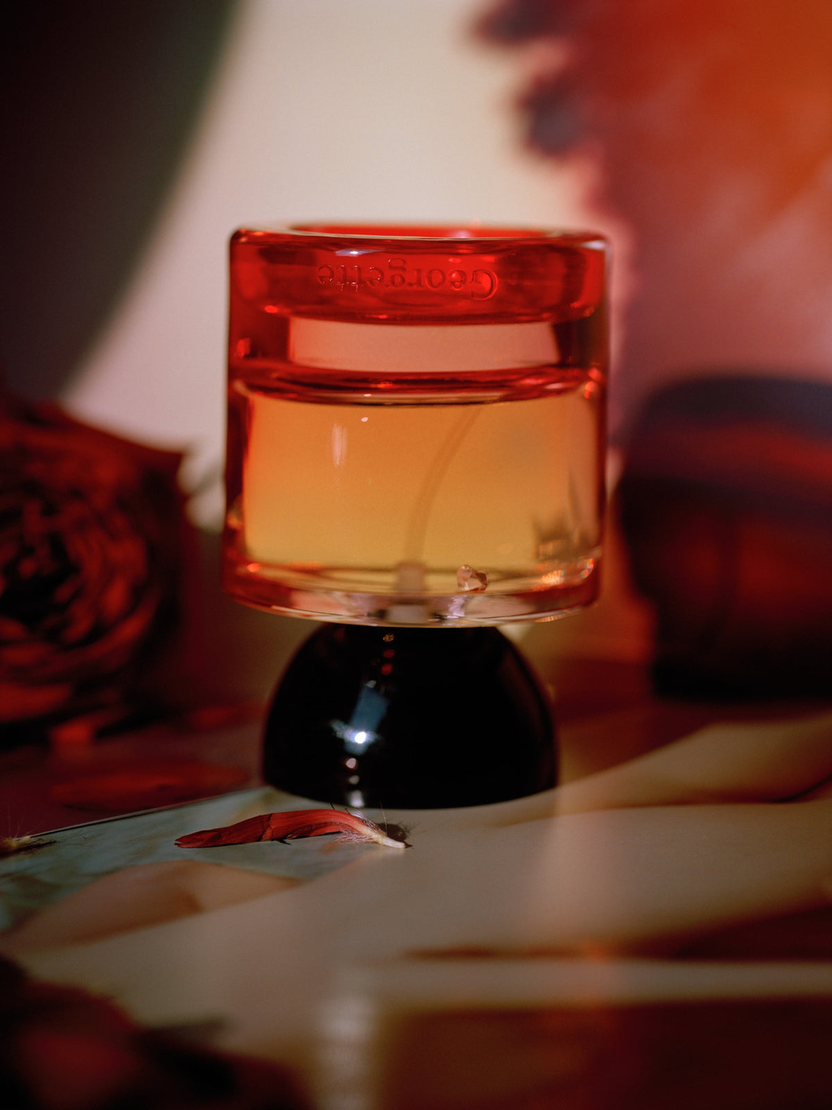 VYRAO Georgette Eau de Parfum bottle in warm amber lighting