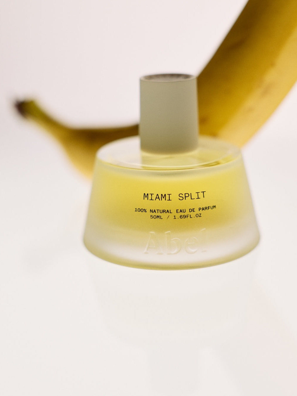 ABEL Miami Split 50 ml 100% Natural Eau de Parfum bottle with banana in background