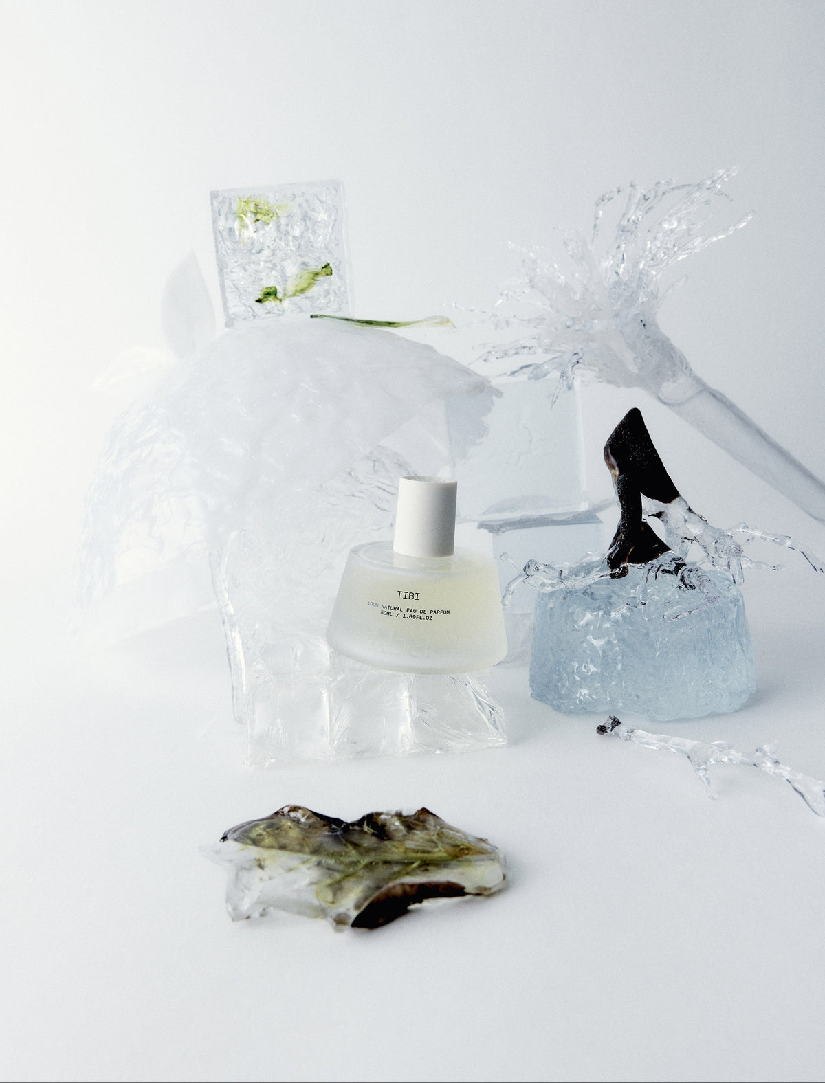 ABEL Tibi Lifestyle Image featuring the perfume bottle and different glass elements