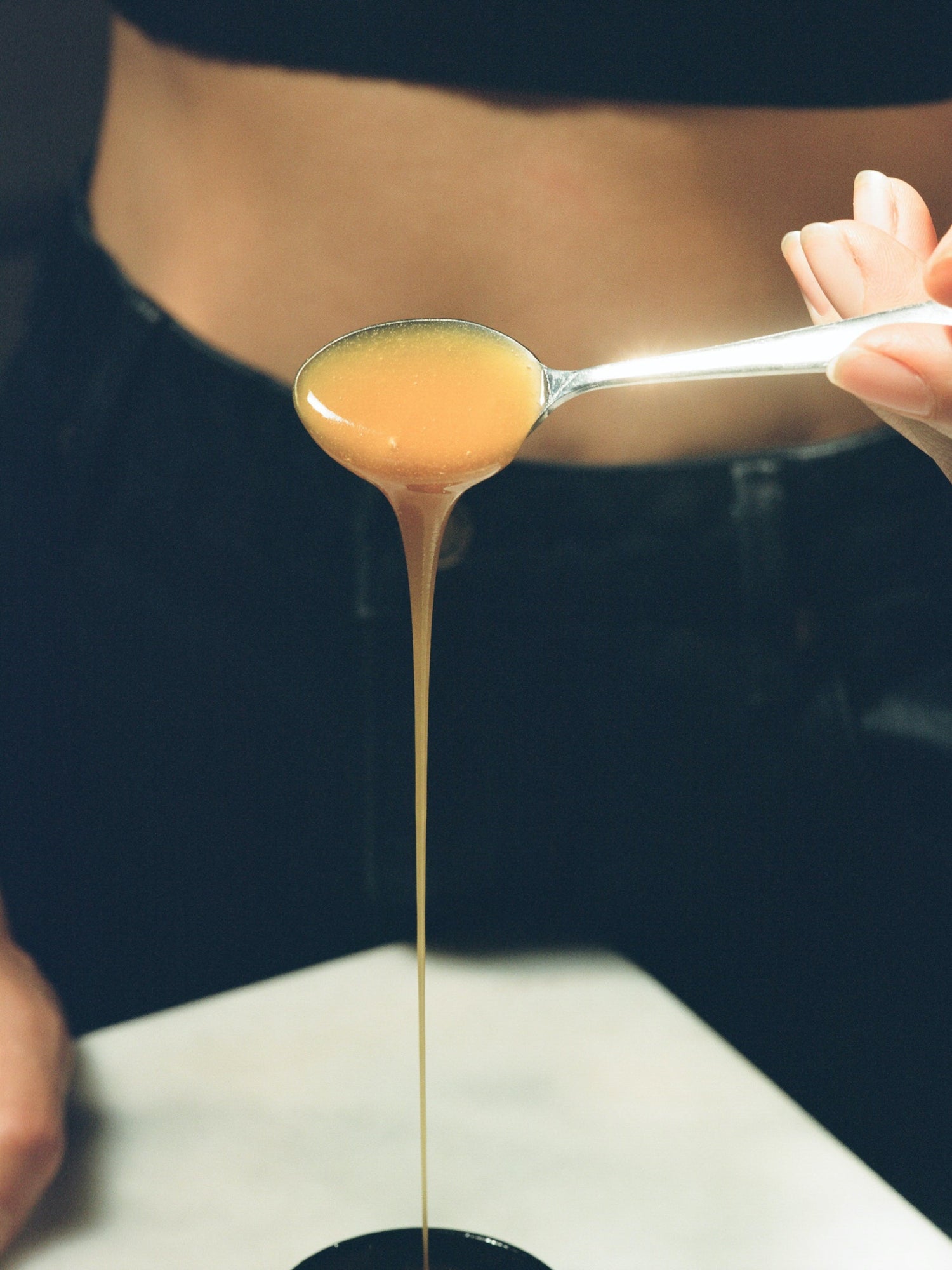 Flowing Activist Manuka Honey from a spoon