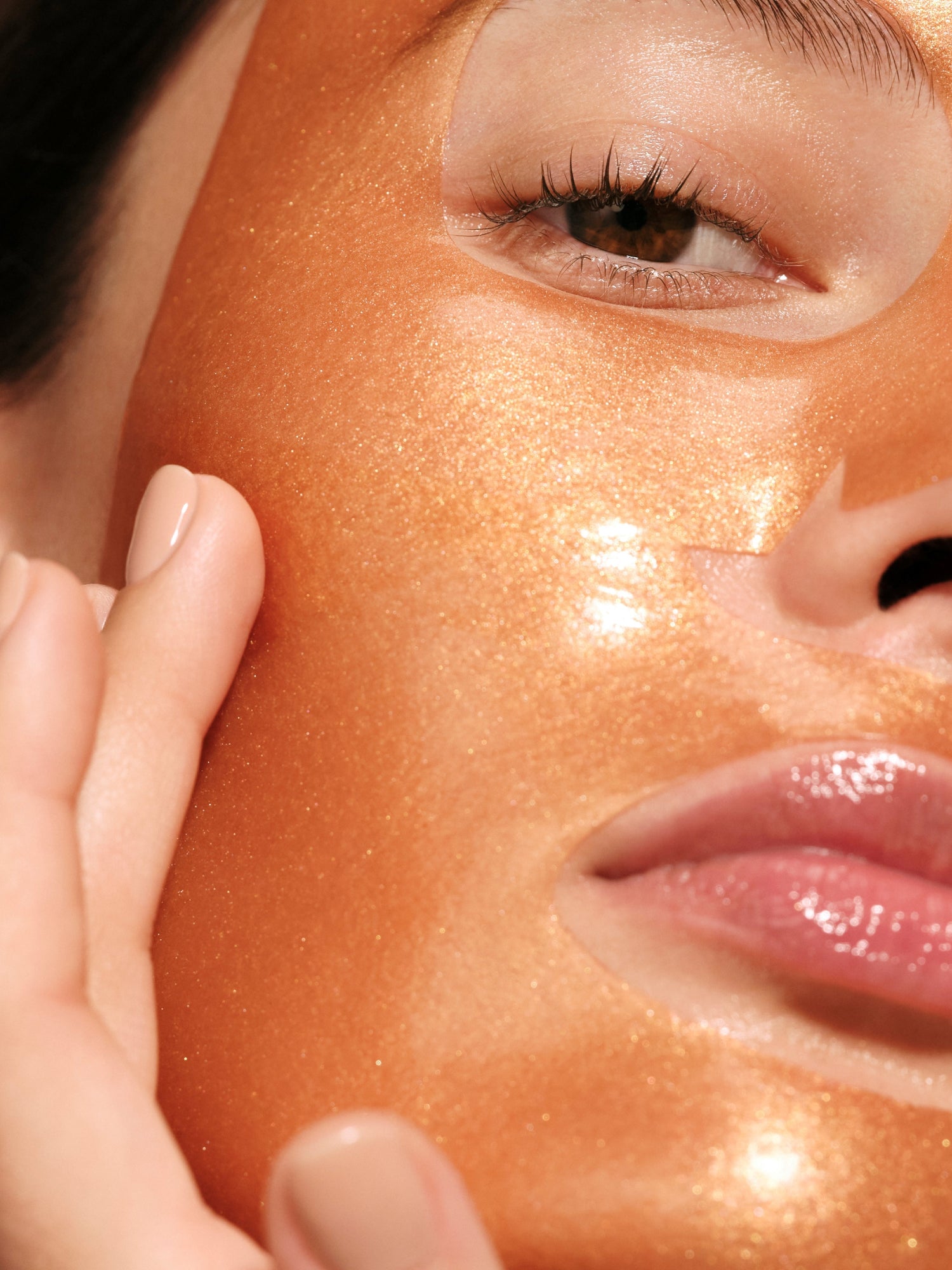 Model wearing Augustinus Bader The Hydrogel Face Mask