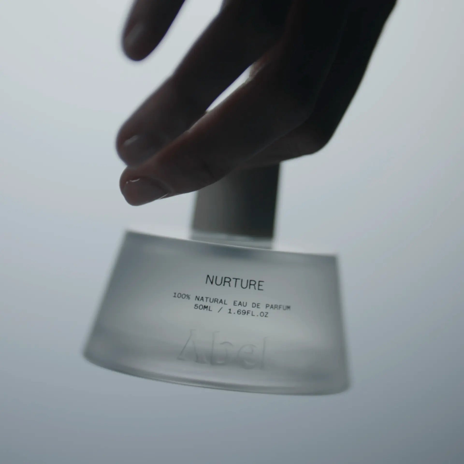 ABEL Nurture 50 ml 100% Natural Eau de Parfum bottle with hand reaching above