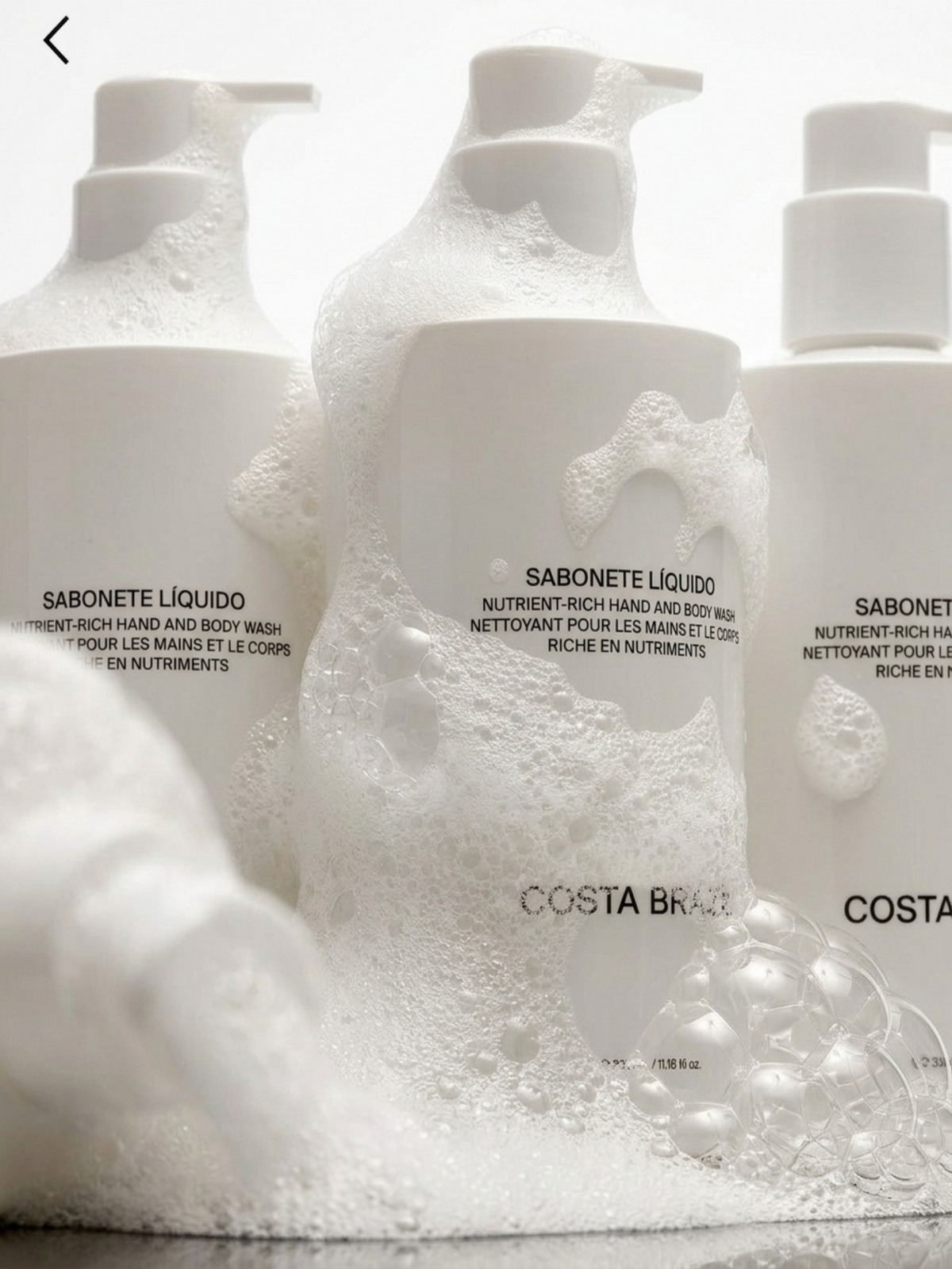 COSTA BRAZIL Sabonete Líquido Nutrient-Rich Hand and Body Wash – foaming body wash bottles surrounded by rich white foam