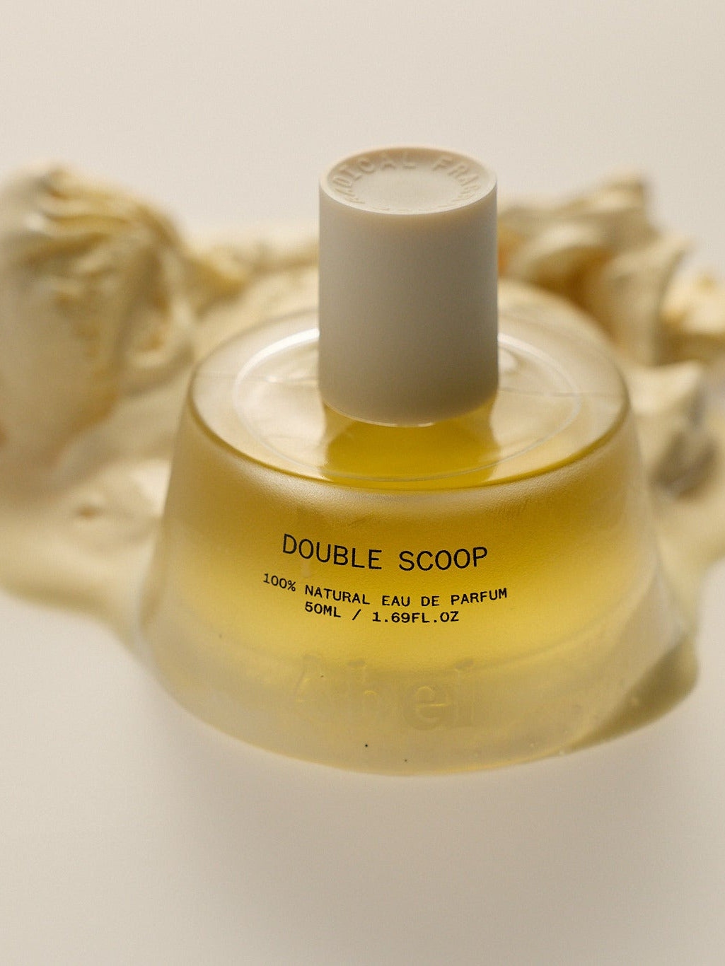 A bottle of perfume by ABEL named Double Scoop on a neutral background