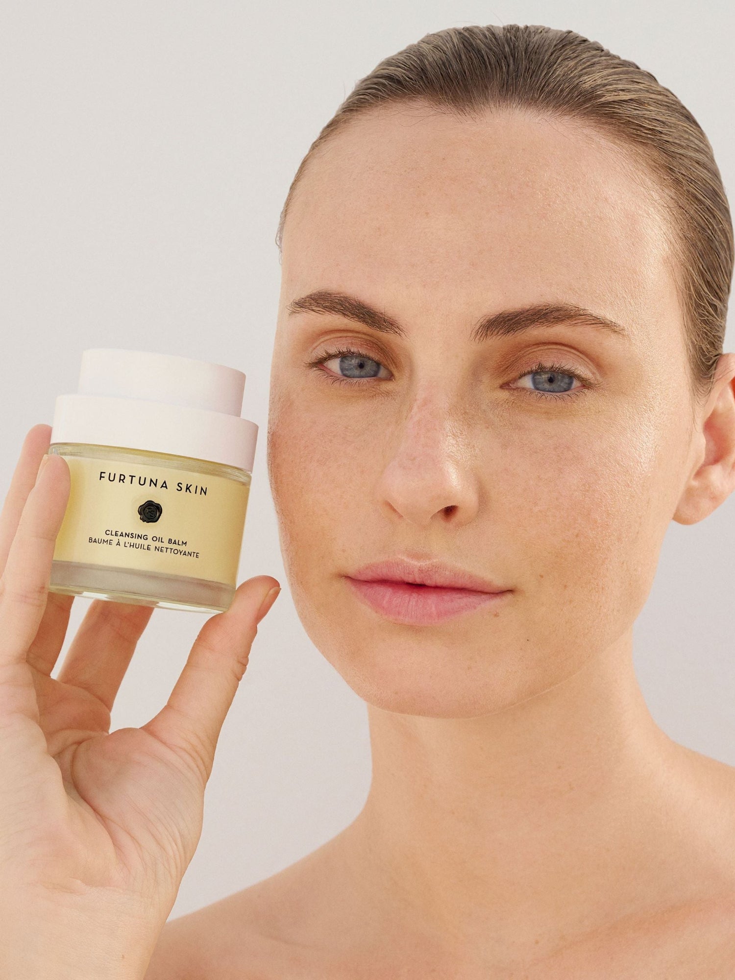 Furtuna Skin Cleansing Oil Balm held by model