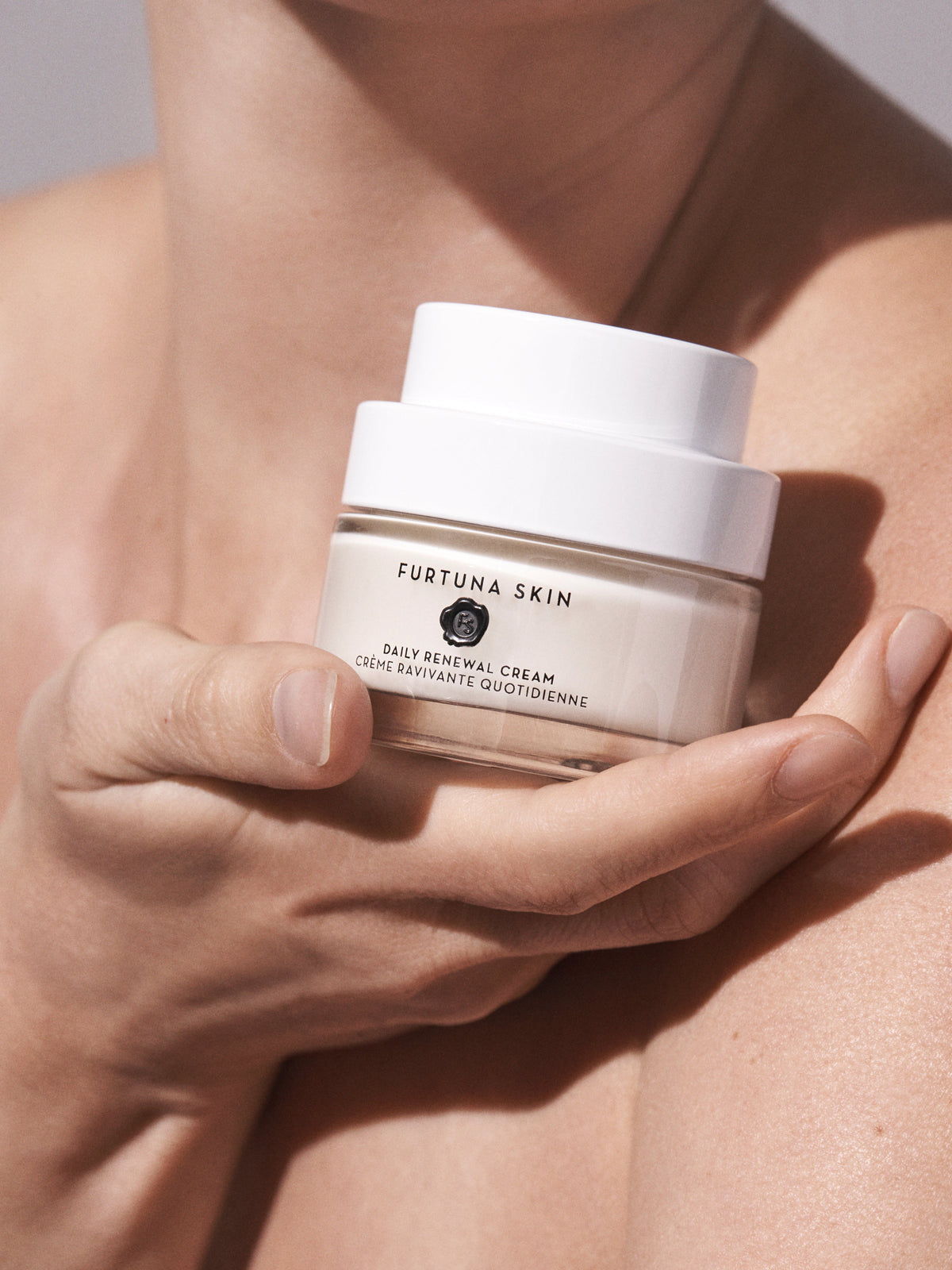 Furtuna Skin Daily Renewal Cream held in hands