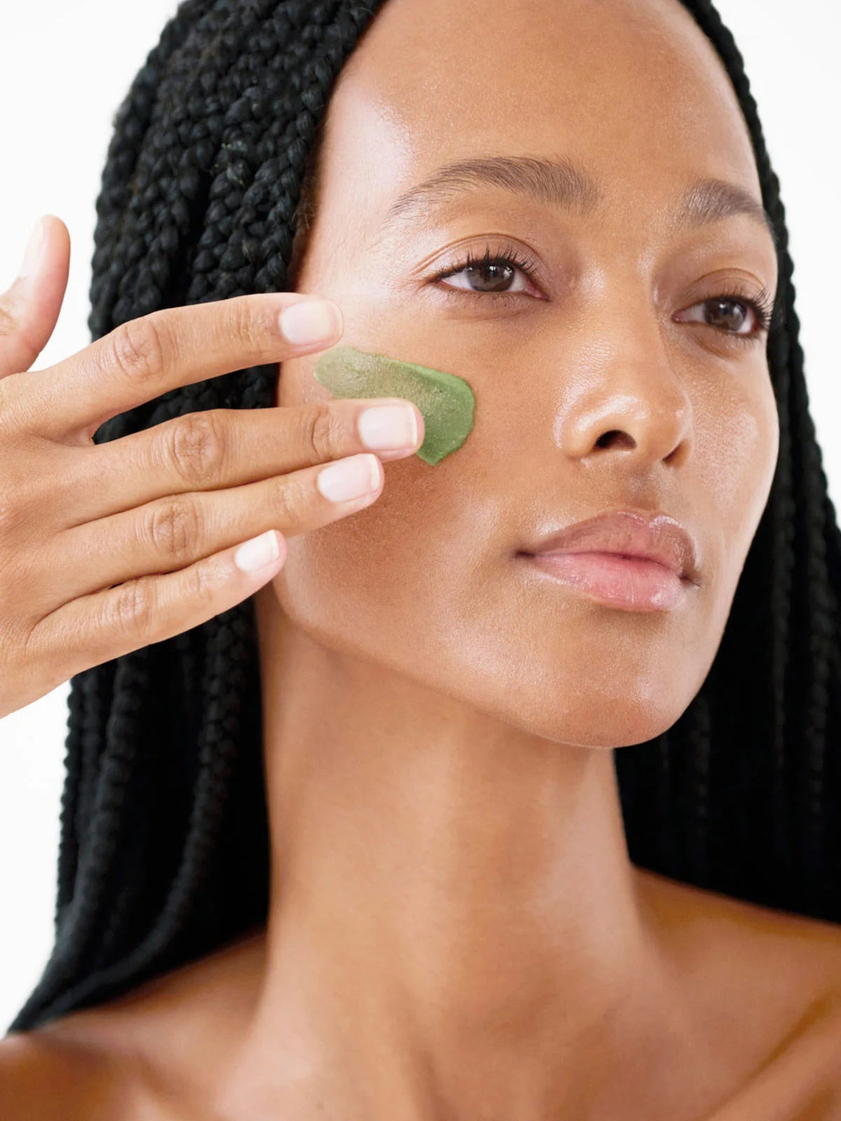Furtuna Skin Triple Active Exfoliator 80 ml applied to model's face