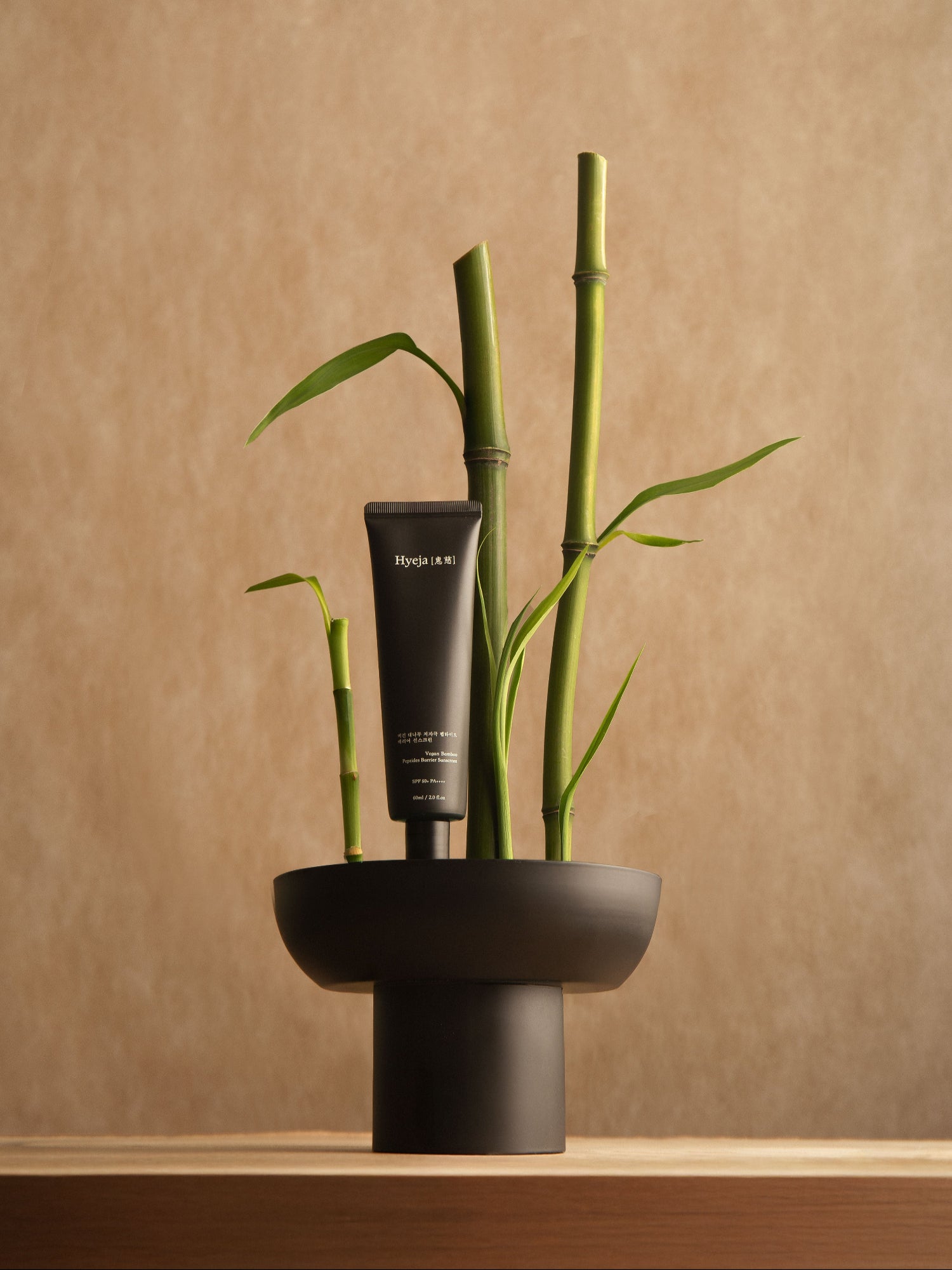 HYEJA Bamboo Peptides SPF 50 sunscreen with bamboo stalks

