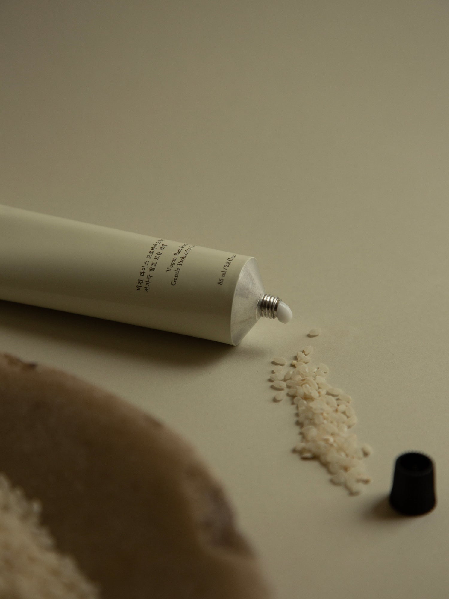 HYEJA Yuja Rice Ferment Cream skincare tube with rice grains