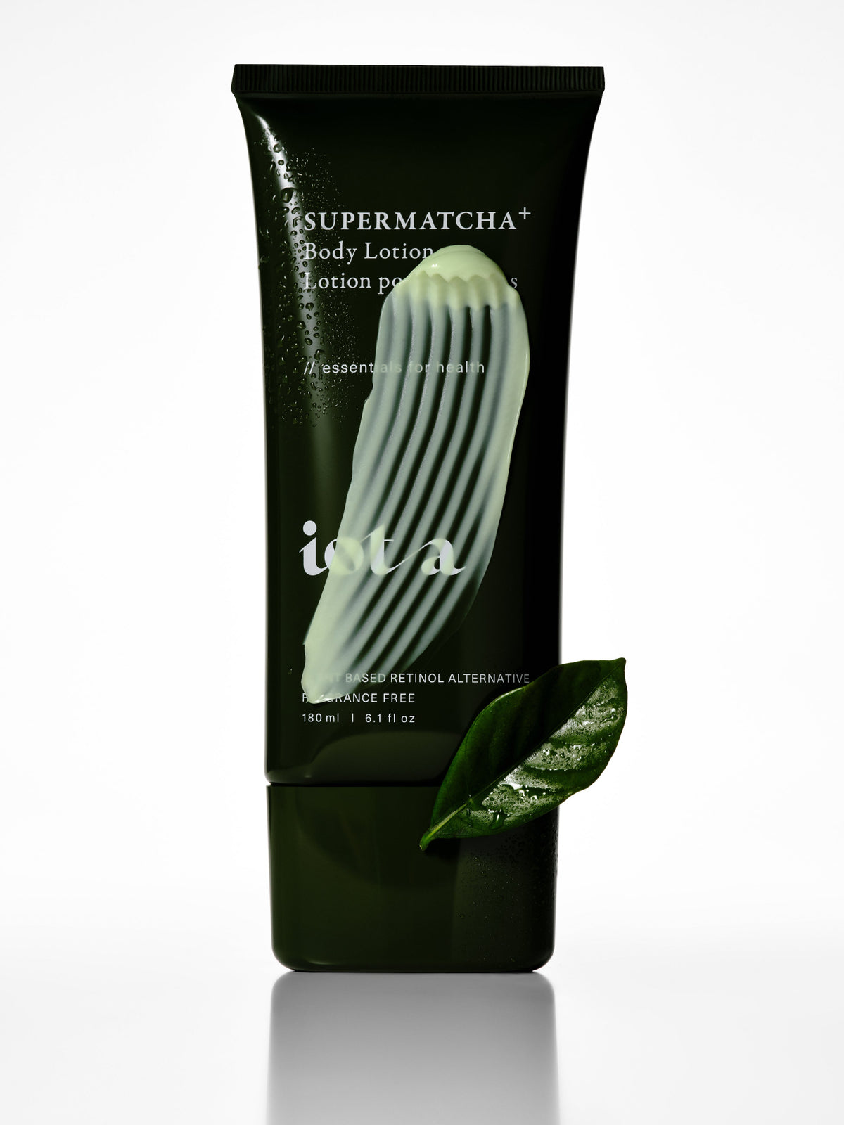 IOTA Supermatcha+ Body Lotion in green tube, lifestyle product image featuring texture swatch