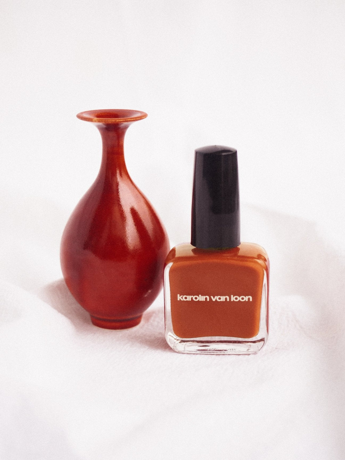 Karolin Van Loon Tulip Orange nail polish lifestyle image with decorative vase