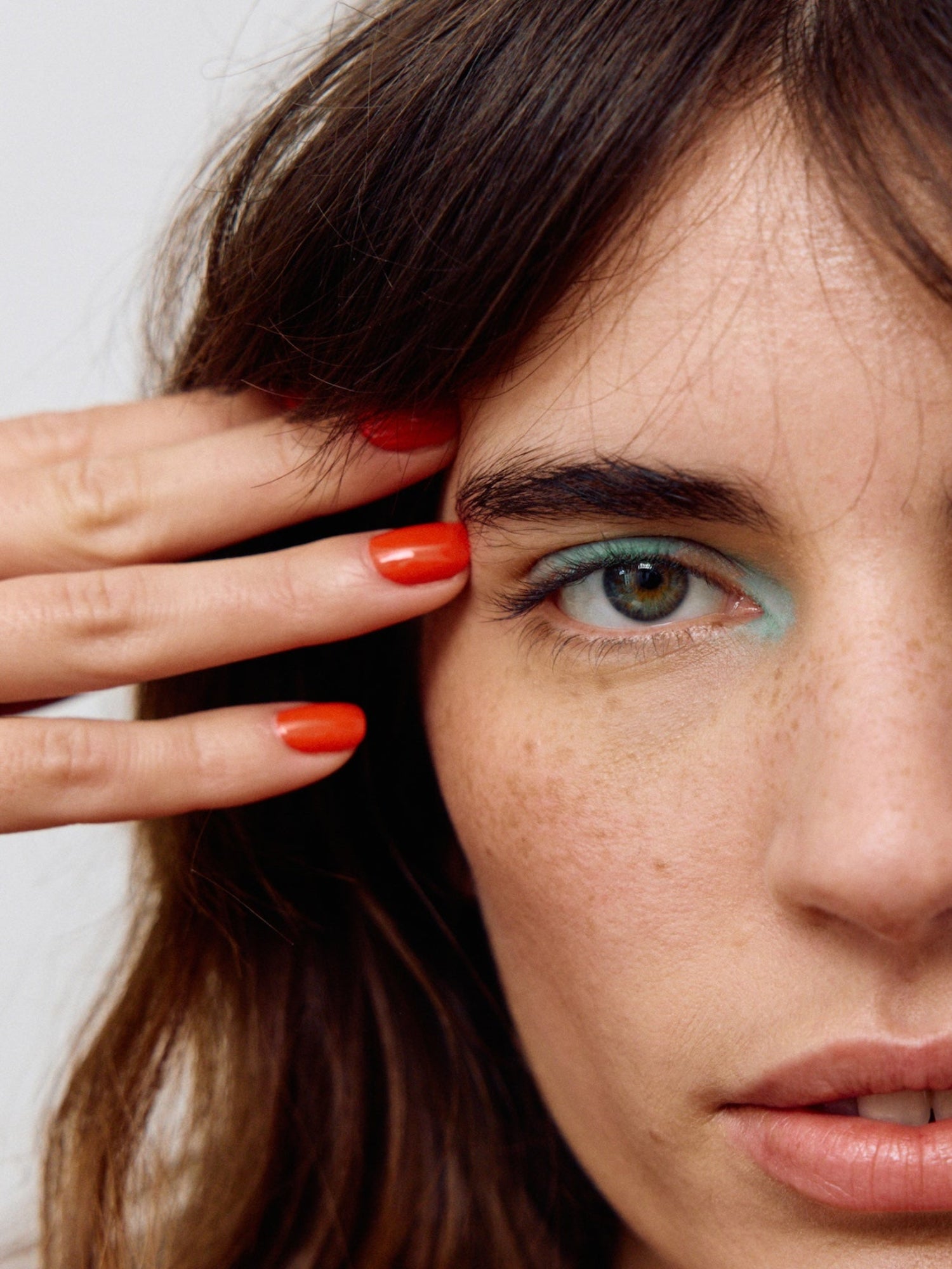 KAROLIN VAN LOON Rouge Solaire vibrant red nail polish on nails