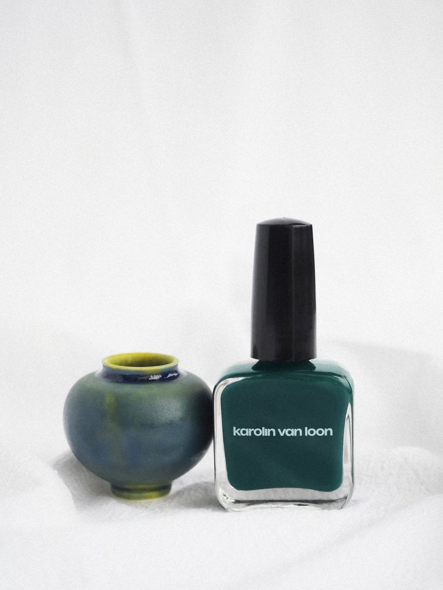 KAROLIN VAN LOON Feuille Lotus midnight green nail polish with ceramic vase
