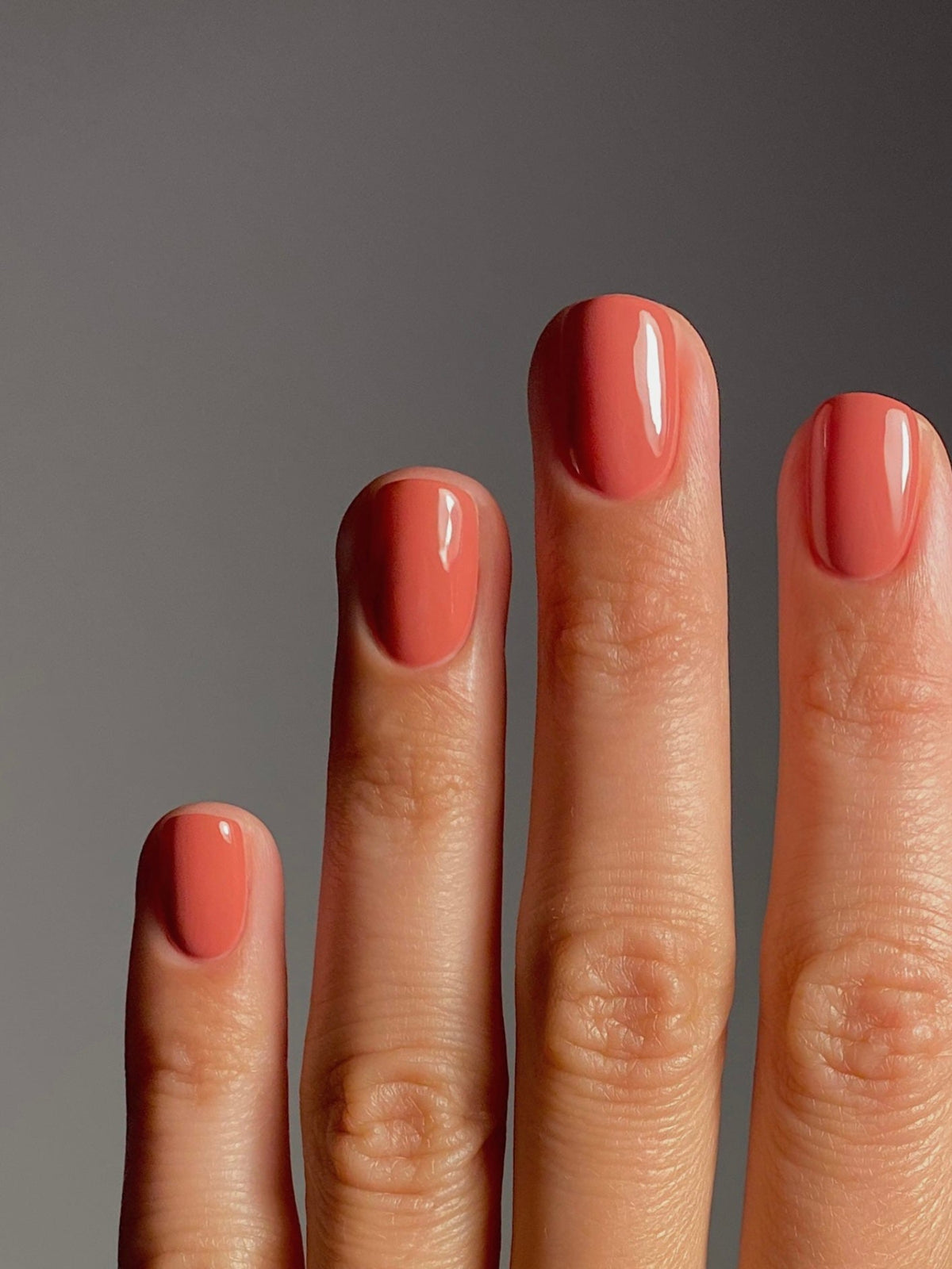 KAROLIN VAN LOON Fleur de Cerise coral nail polish on nails