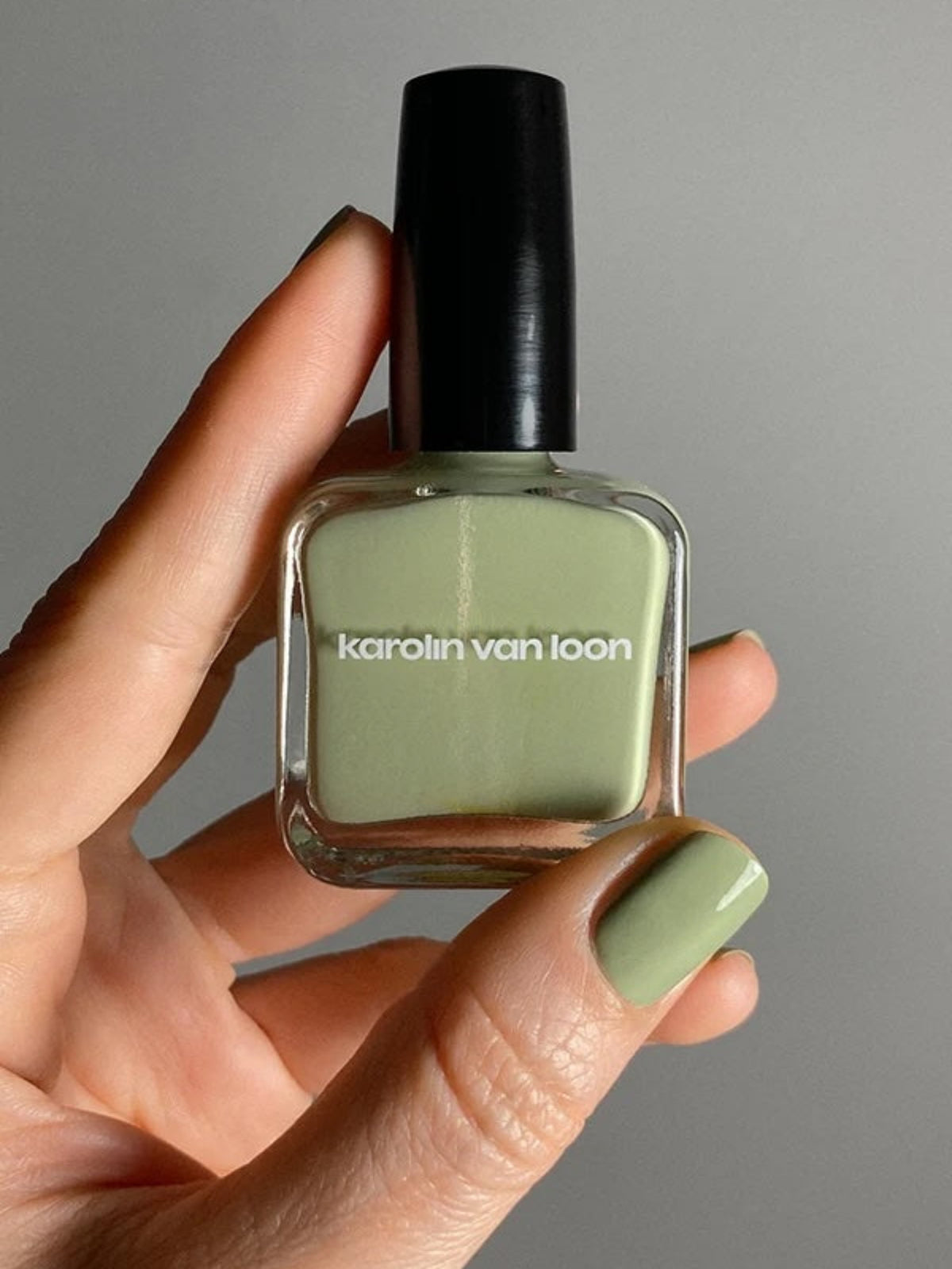 KAROLIN VAN LOON Fleur de Menthe mint green nail polish on nails with bottle