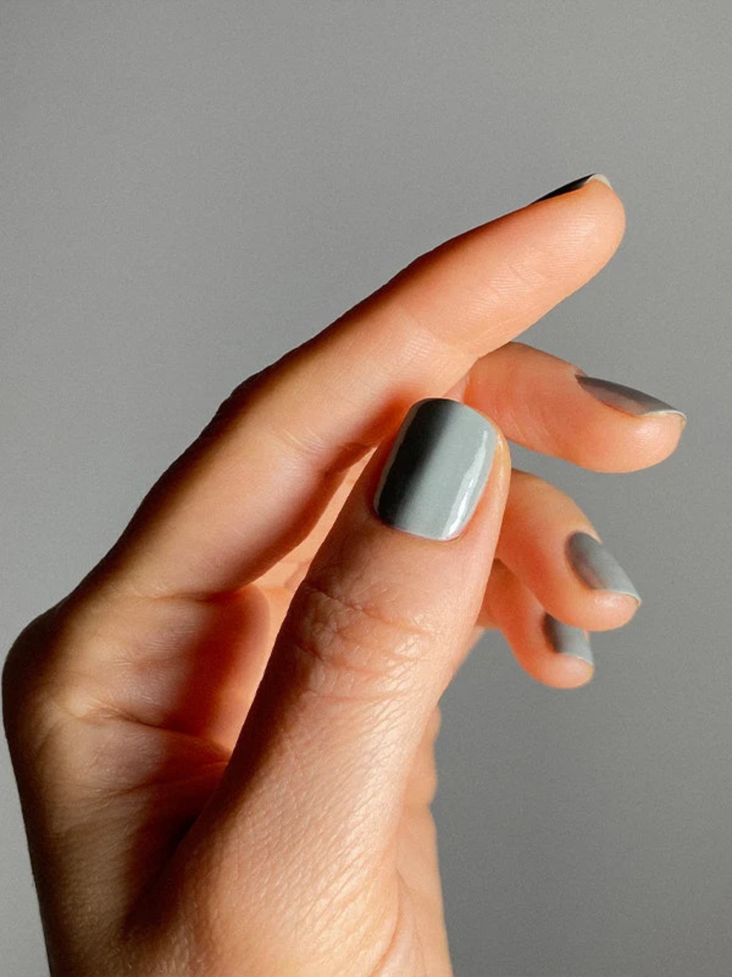 Karolin van Loon Terre Verte muted sage green nail polish on nails