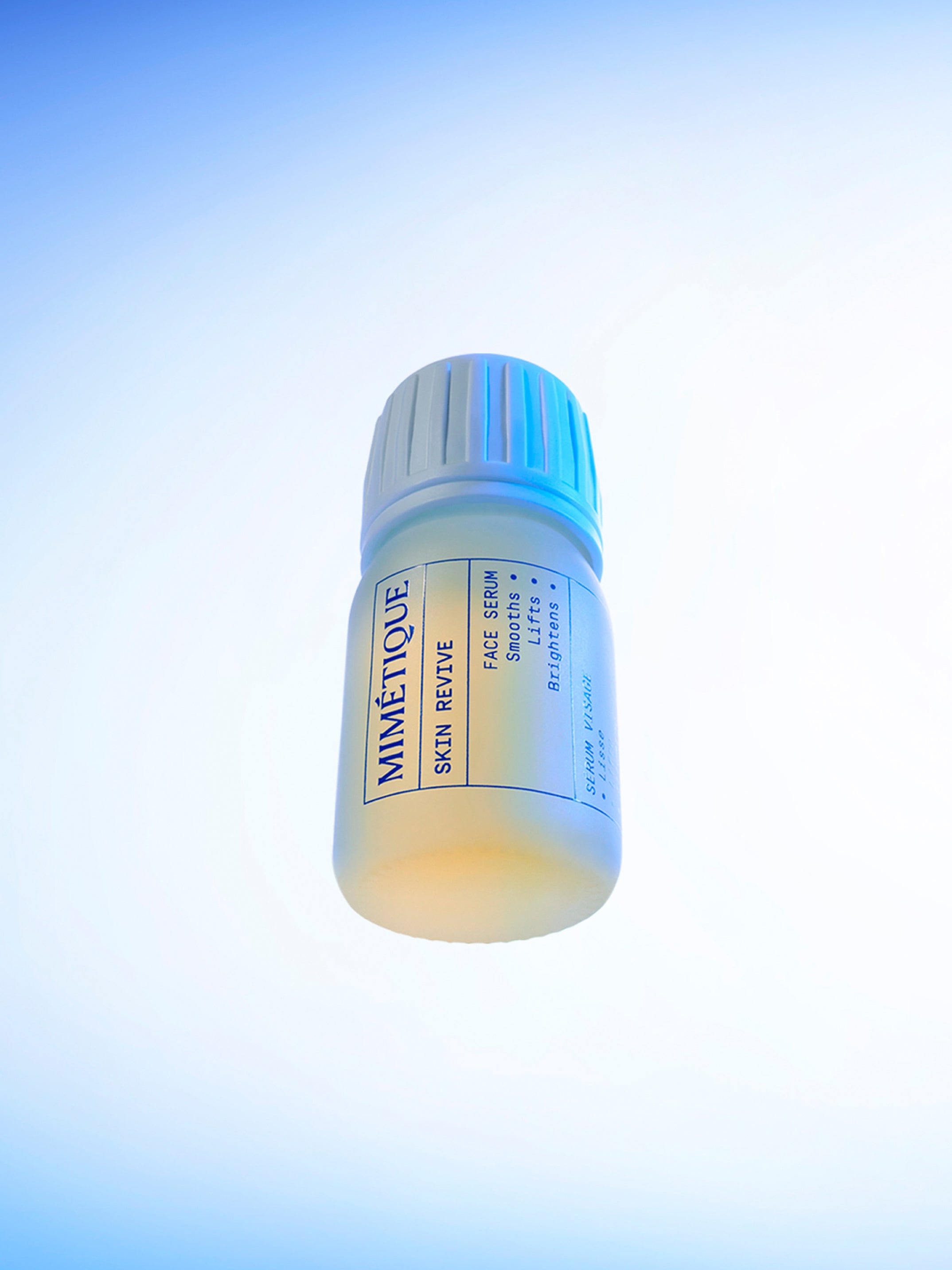 bottle of MIMÉTIQUE Skin Revive Smoothing Face Serum shot from below