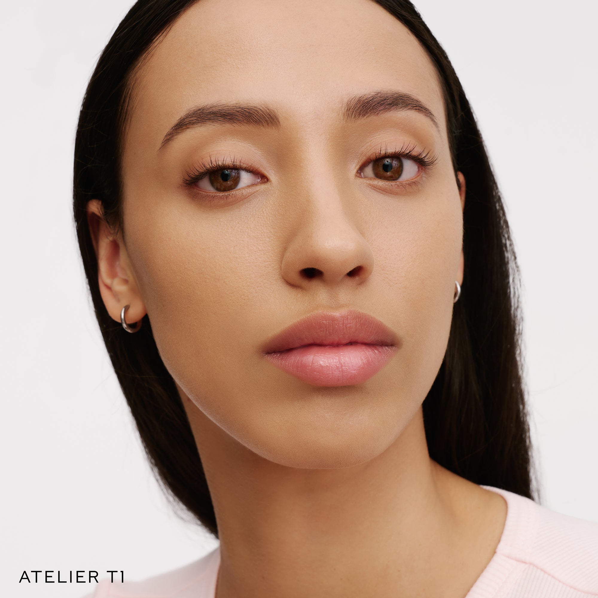 The Face of a Model wearing the WESTMAN ATELIER Suprême Bio-Complex Liquid Foundation in the shade T1