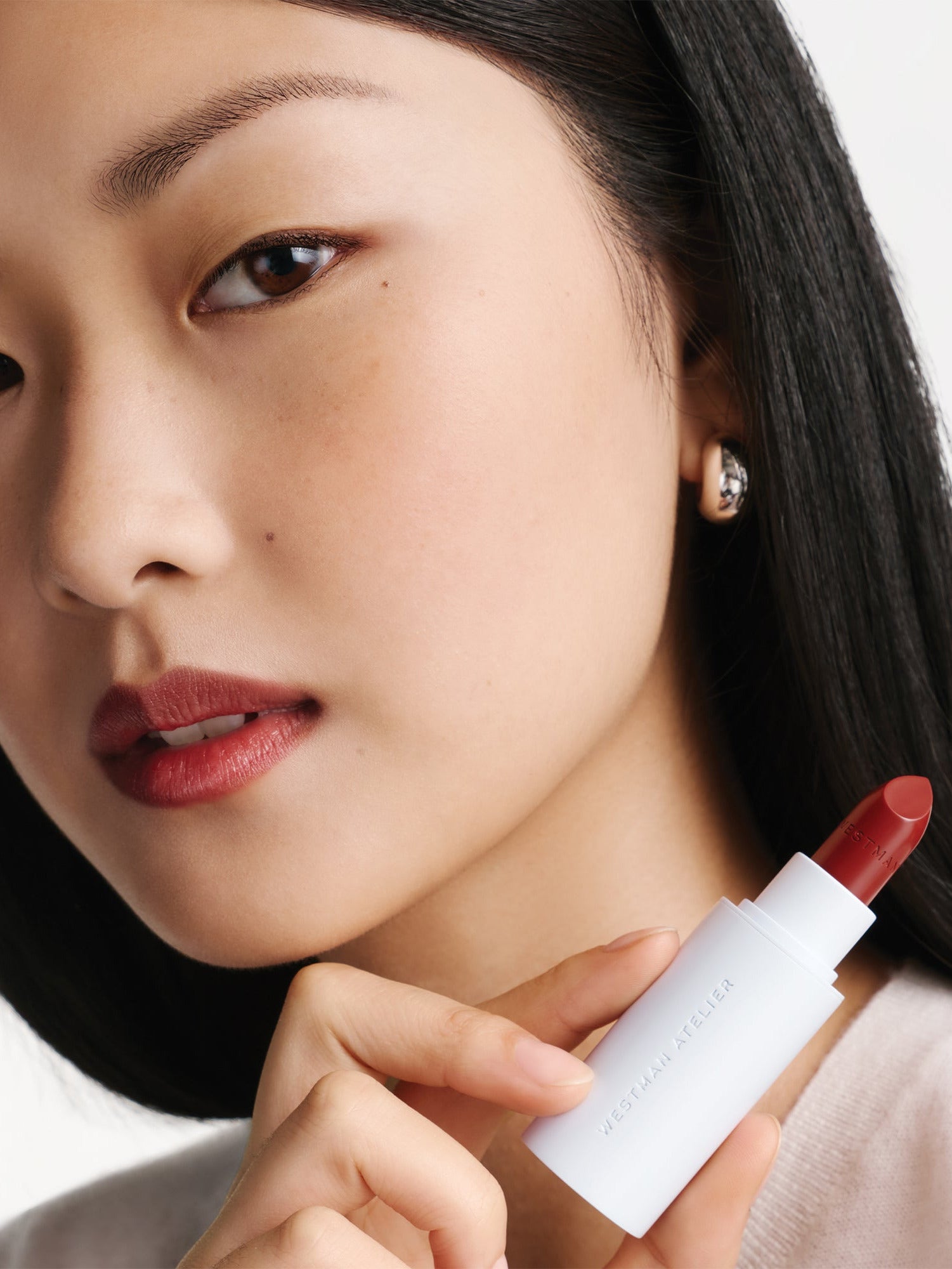 WESTMAN ATELIER HydroBalm Tinted Lipstick in Brique Model