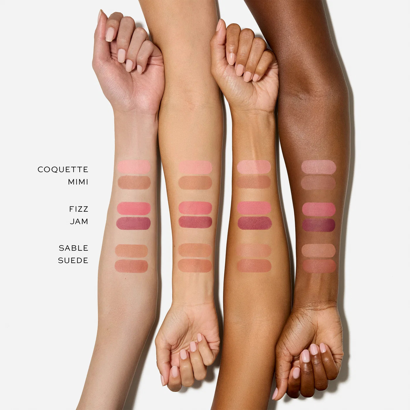 Westman Atelier Powder Blush Duo arm swatches in shades Coquette, Mimi, Fizz, Jam, Sable and Suede on four different skin tones.