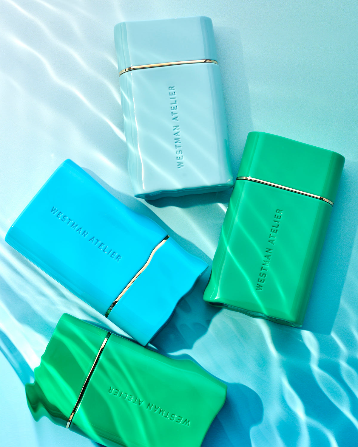 WESTMAN ATELIER Sun Tone Bronzing Drops in blue water lifestyle image 