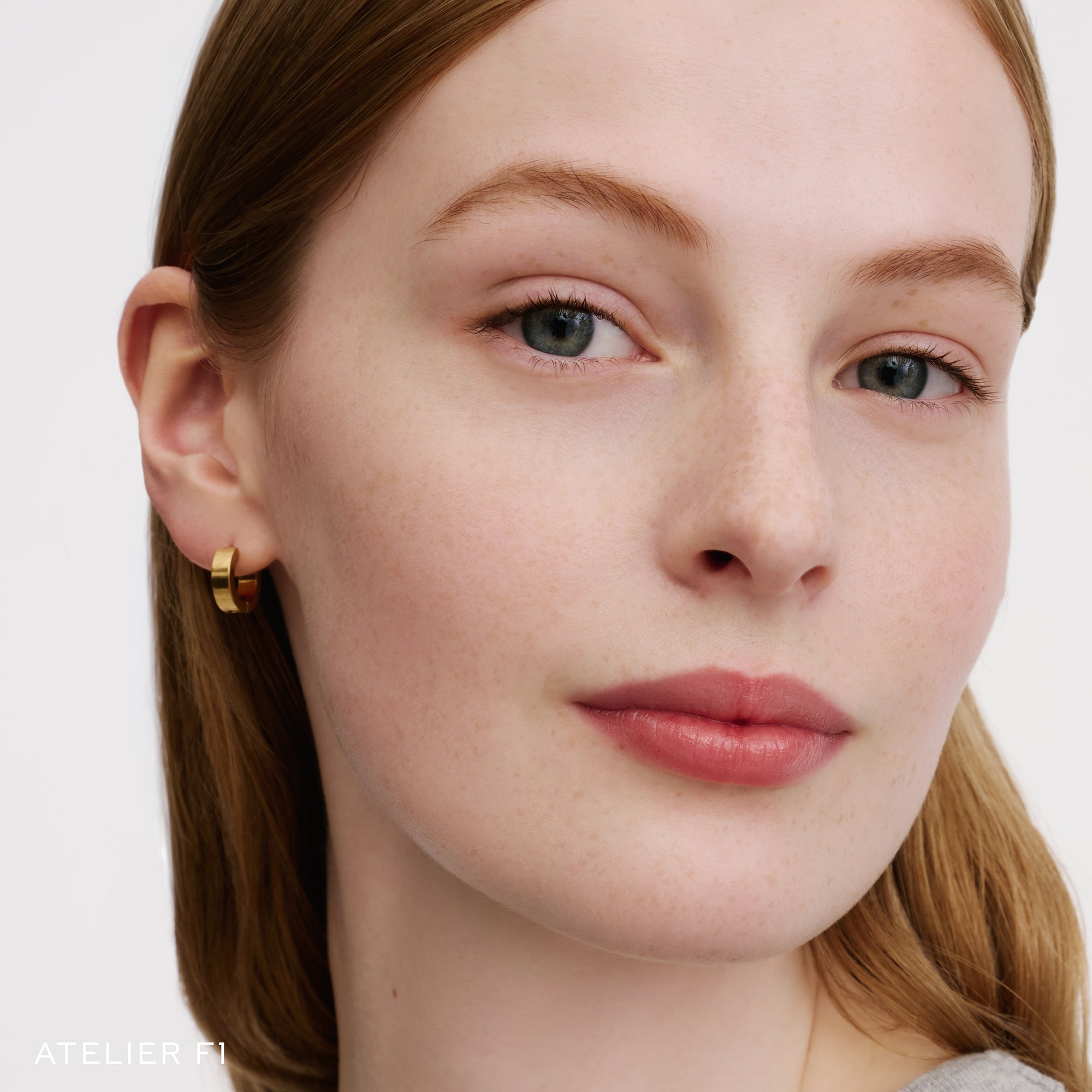 The Face of a Model wearing the WESTMAN ATELIER Suprême Bio-Complex Liquid Foundation in the shade F1