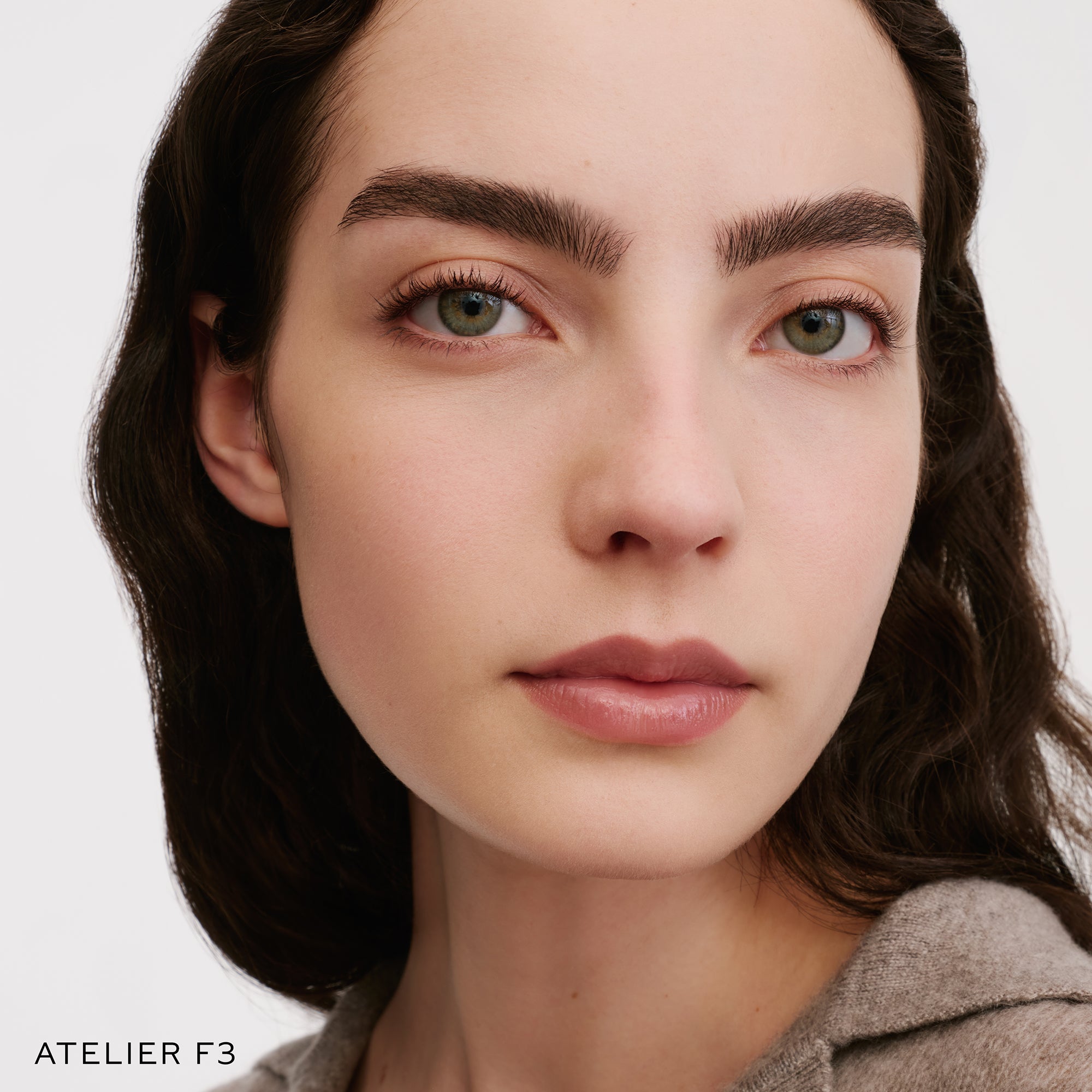 The Face of a Model wearing the WESTMAN ATELIER Suprême Bio-Complex Liquid Foundation in the shade F13