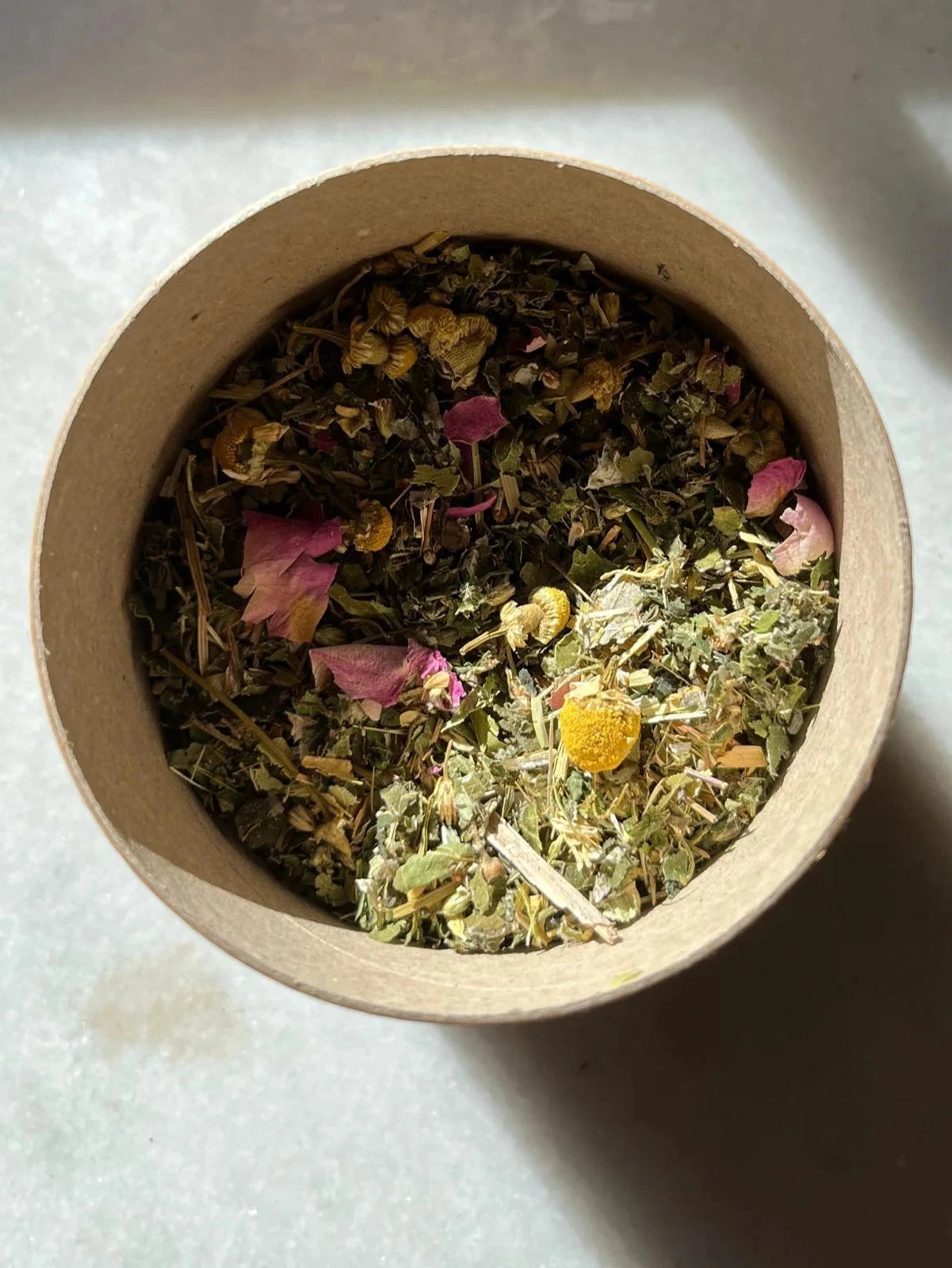 Shot of a bowl full of loose tea WUNDER WORKSHOP Goddess Tea - Yarrow Womb Tonic 