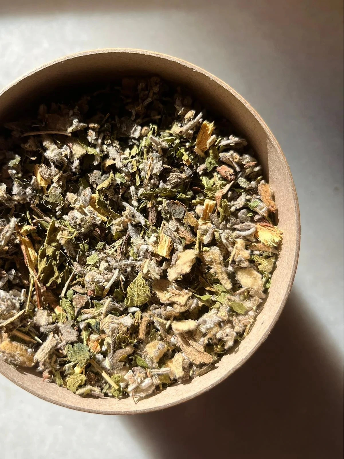 Shot of loose tea in a bowl WUNDER WORKSHOP Purify Tea - Skin & Lung Tonic
