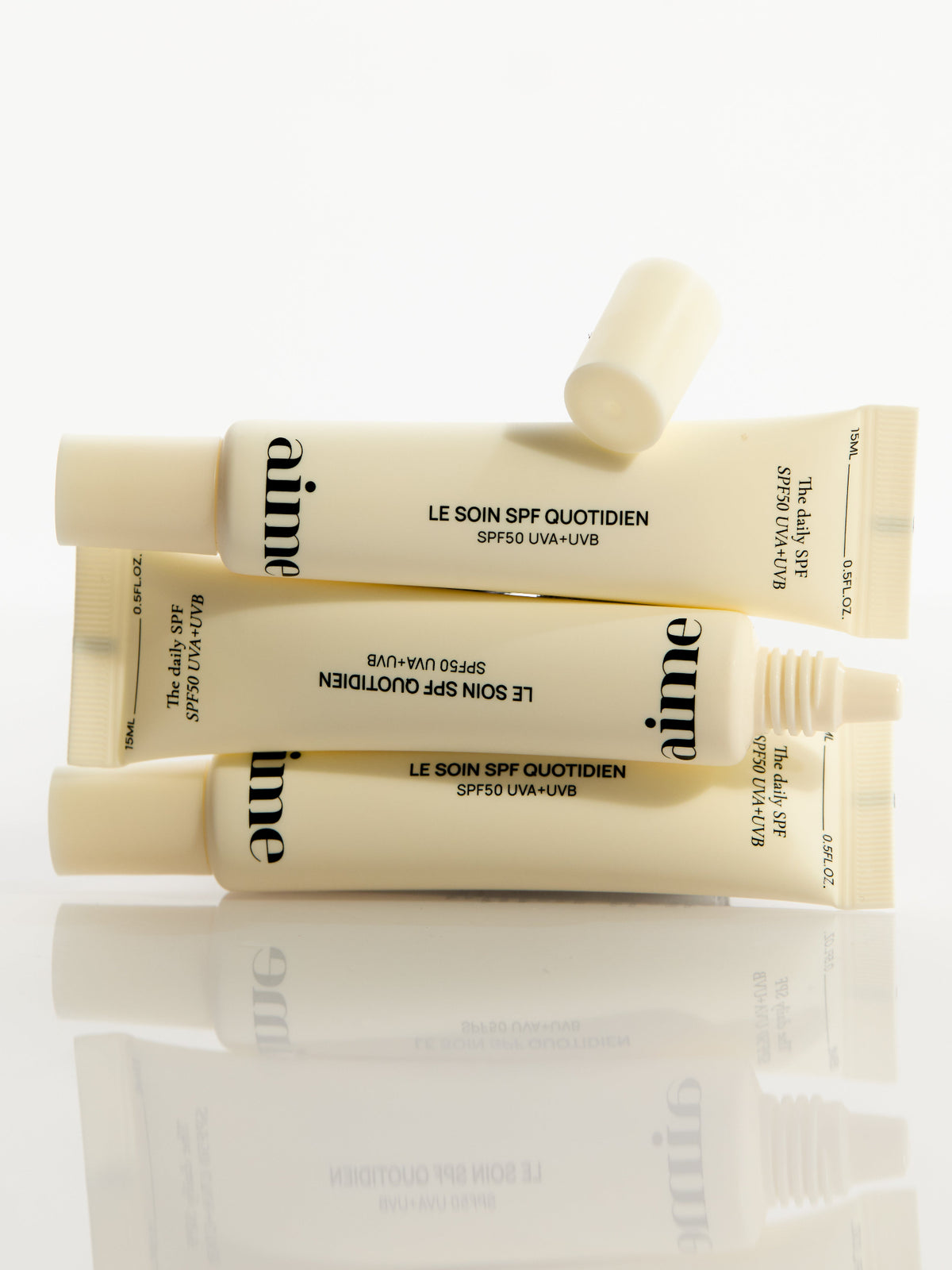AIME The Daily SPF SPF50 UVA+UVB sunscreen tubes lifestyle image