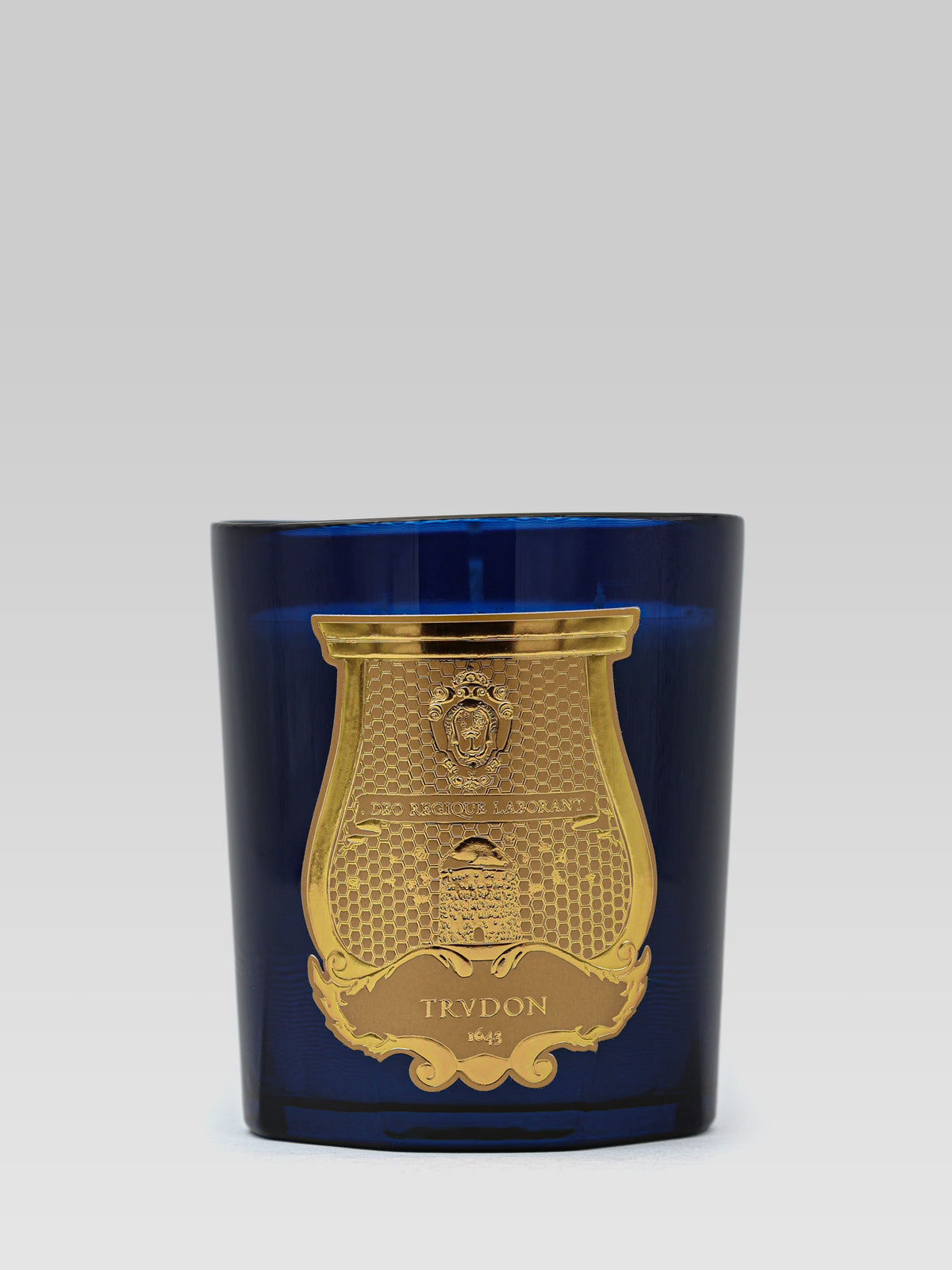 Cire Trudon Madurai scented candle in deep blue glass with gold emblem