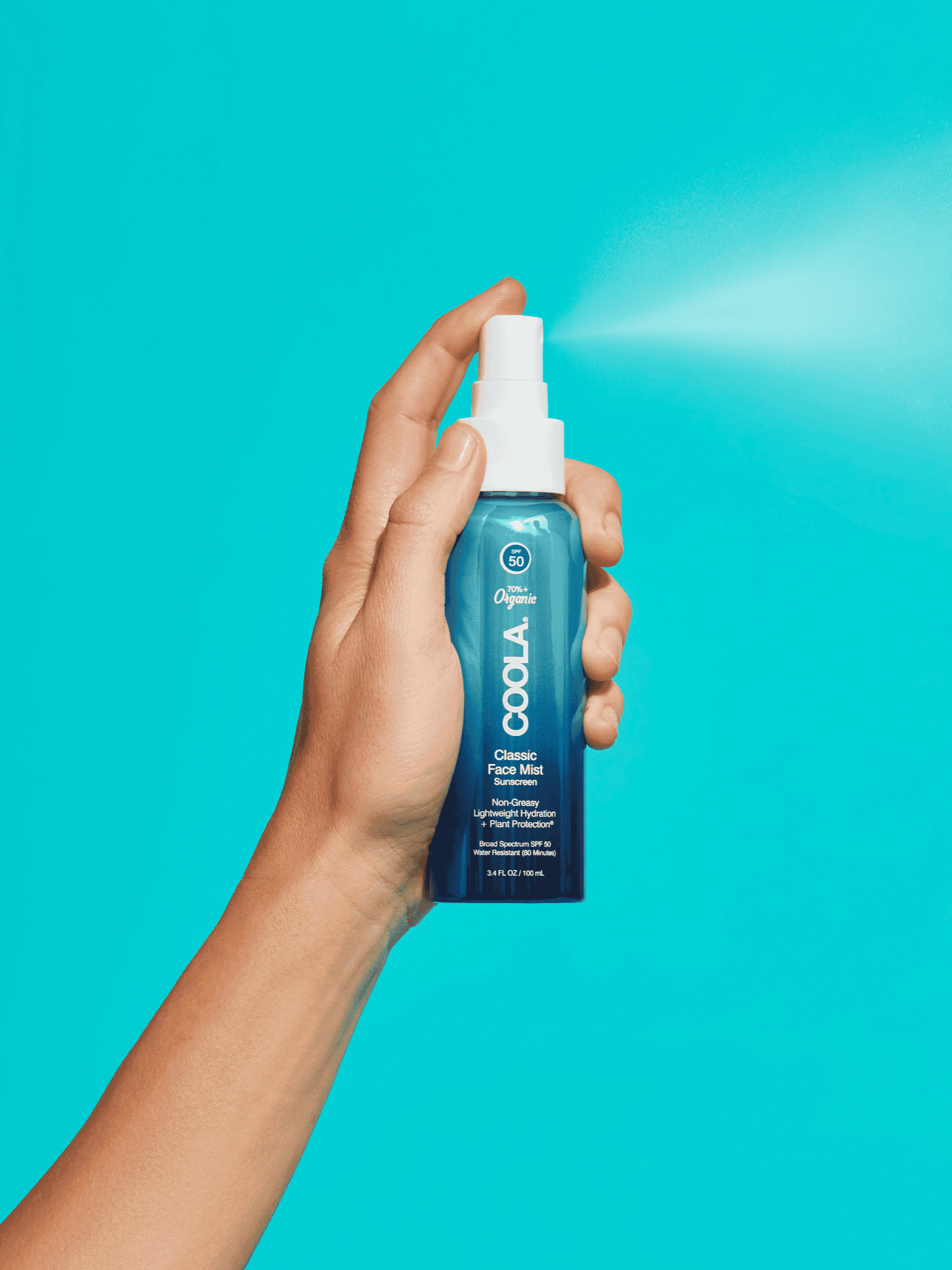 COOLA Classic Face Mist SPF 50 sunscreen spray product in use