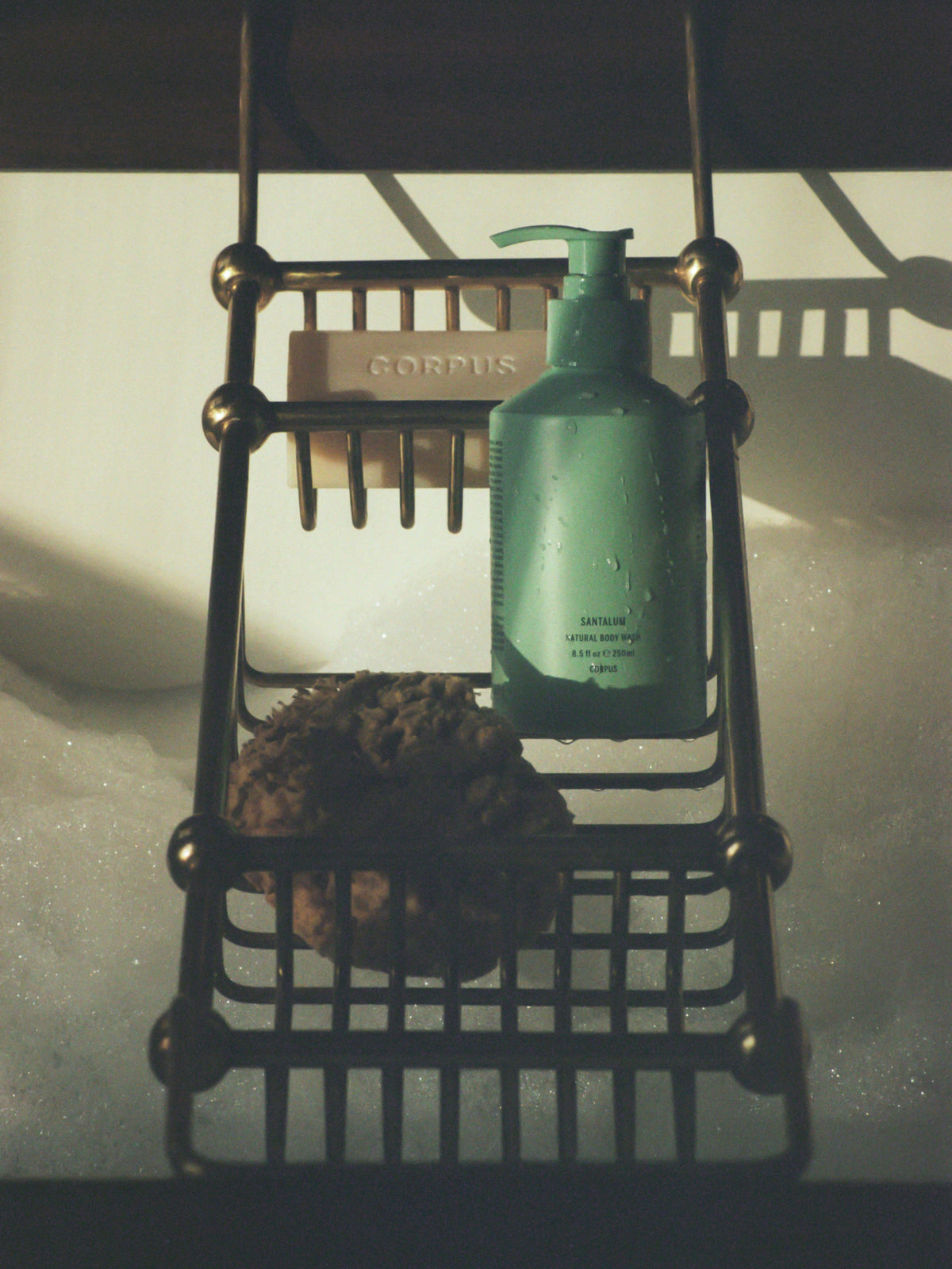 Corpus Body Wash bottle in bathroom shower setting