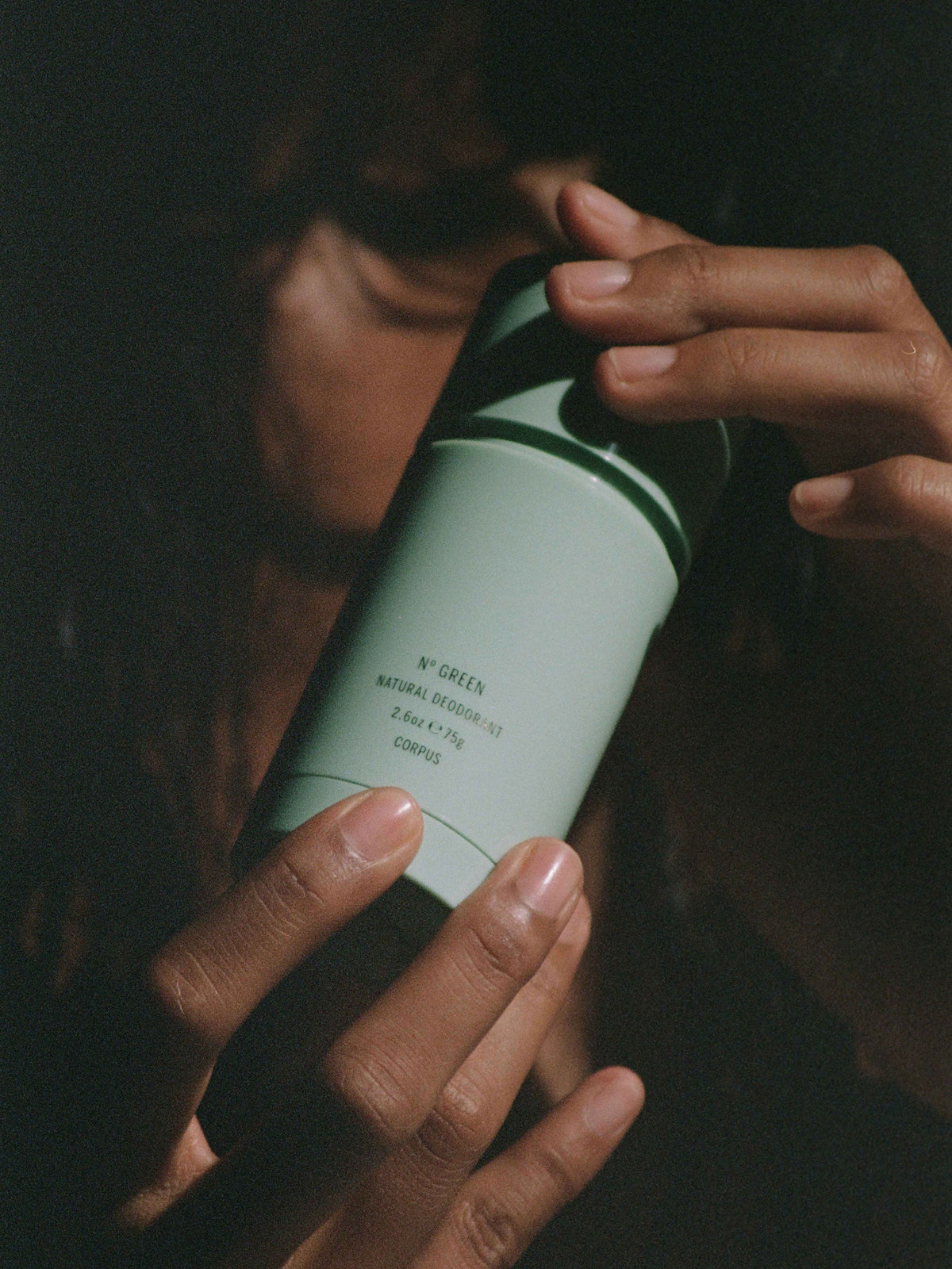 Corpus N Green Vert natural deodorant stick held in hands