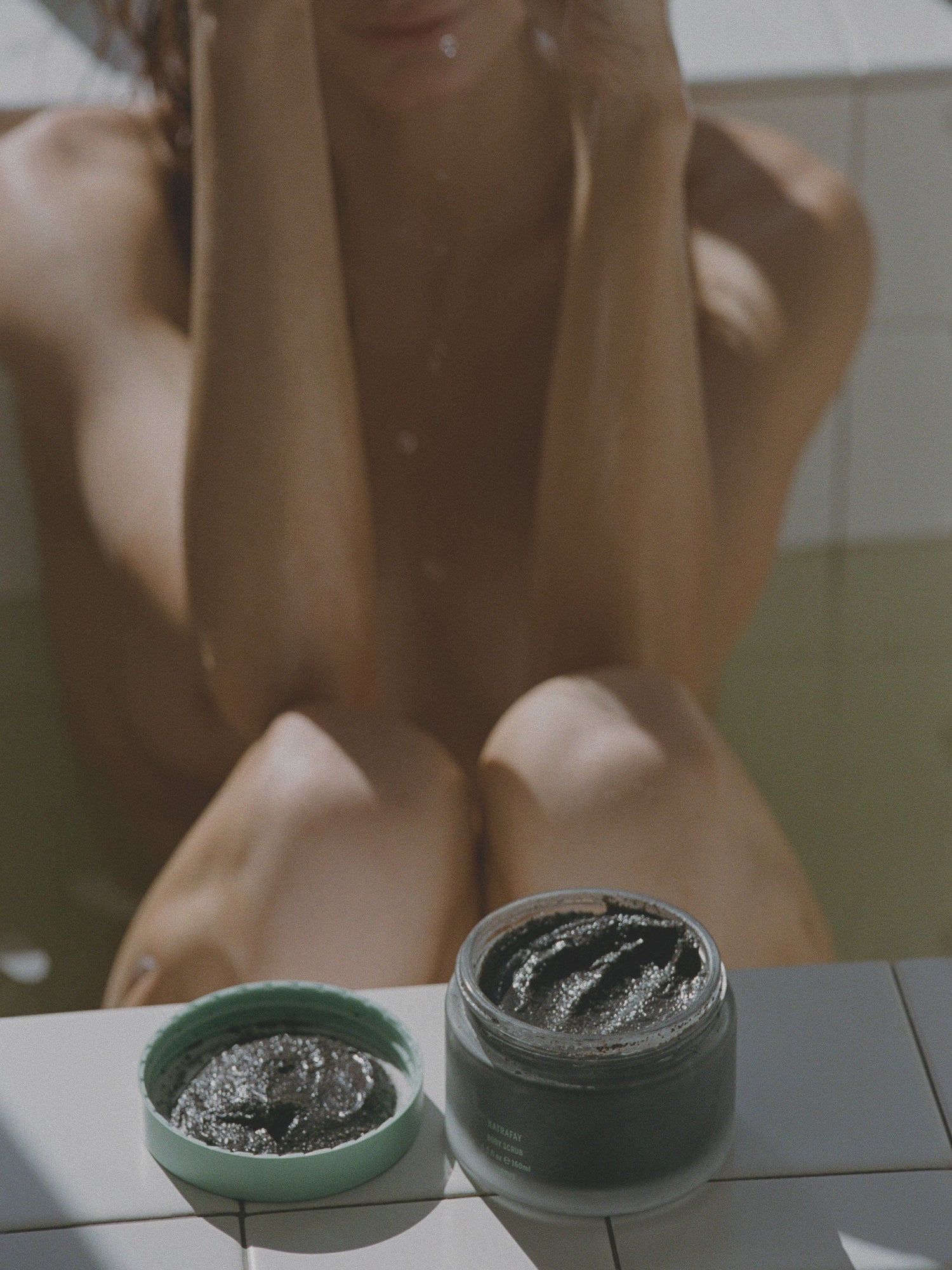 Corpus Katrafay Body Scrub open jar in bathroom setting