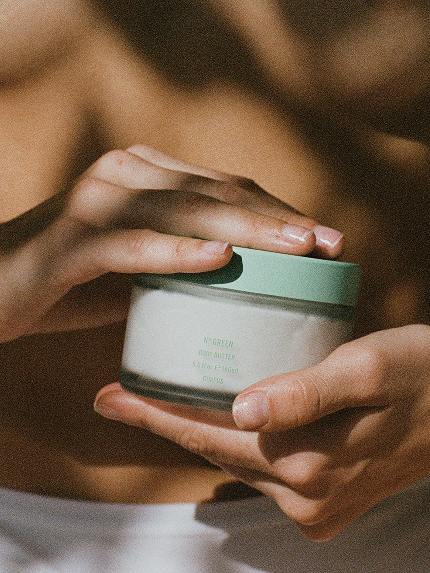 Corpus N° Green Body Butter held in hands