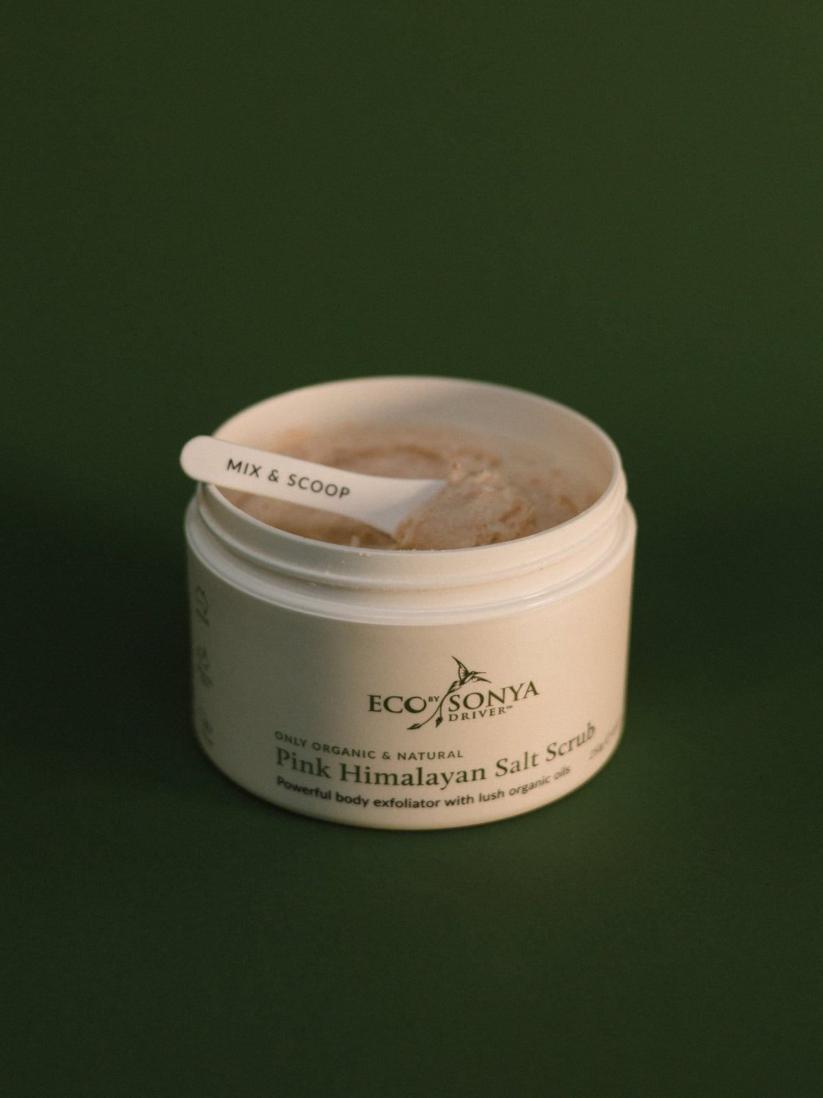 Open jar of Eco by Sonya Pink Himalayan Salt Scrub with body exfoliator
