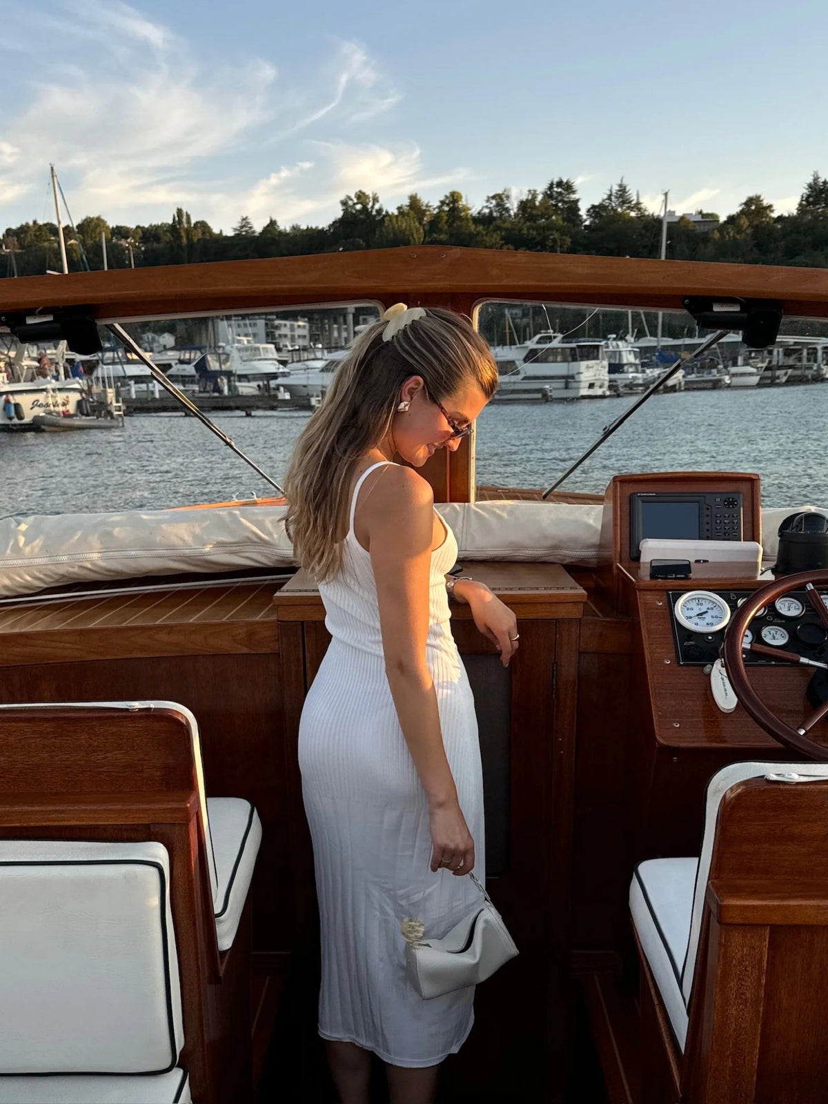 Woman wearing an Emi Jay Lil Effing Clip on a boat